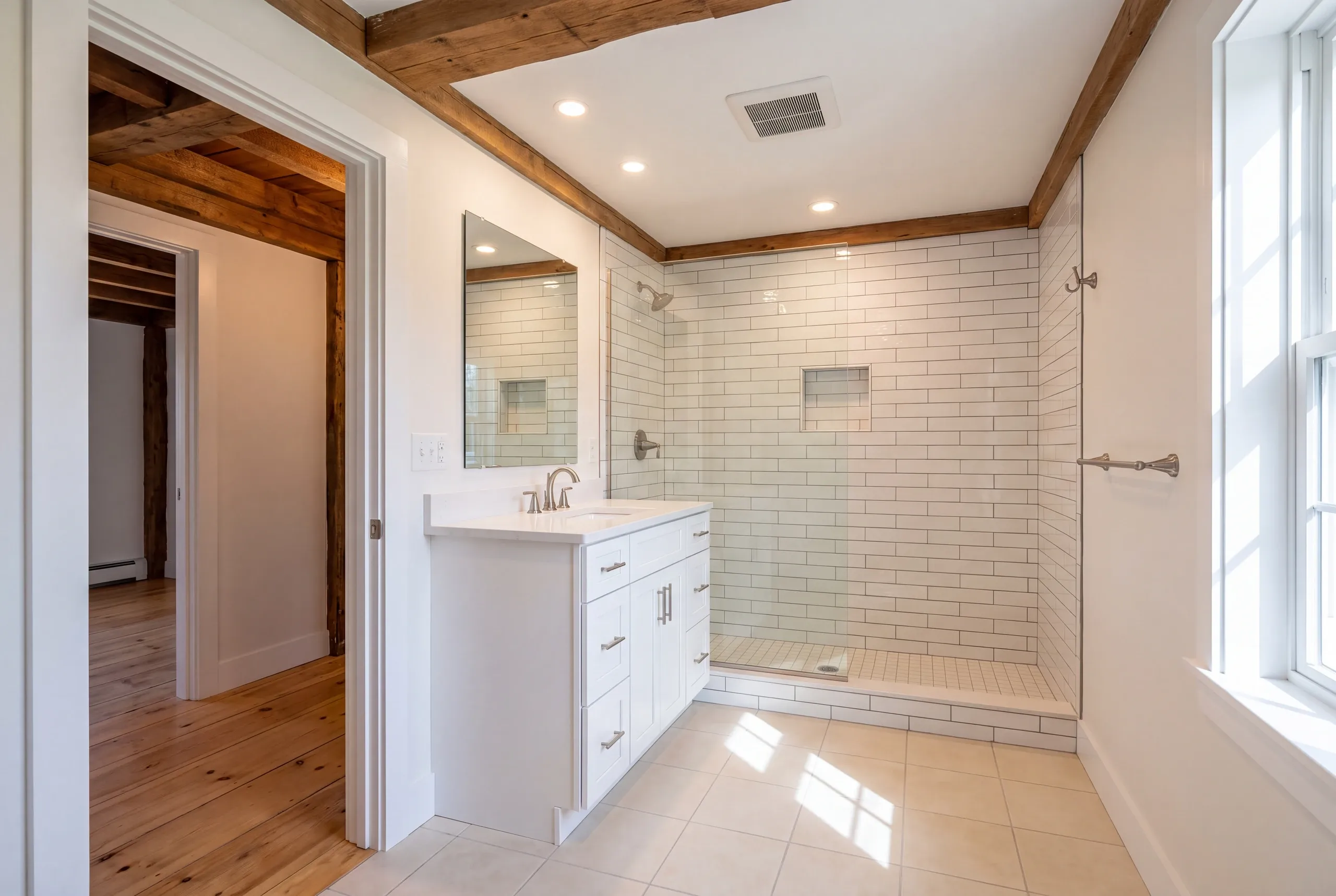 Alna farmhouse bathroom opened to original floor boards and joists