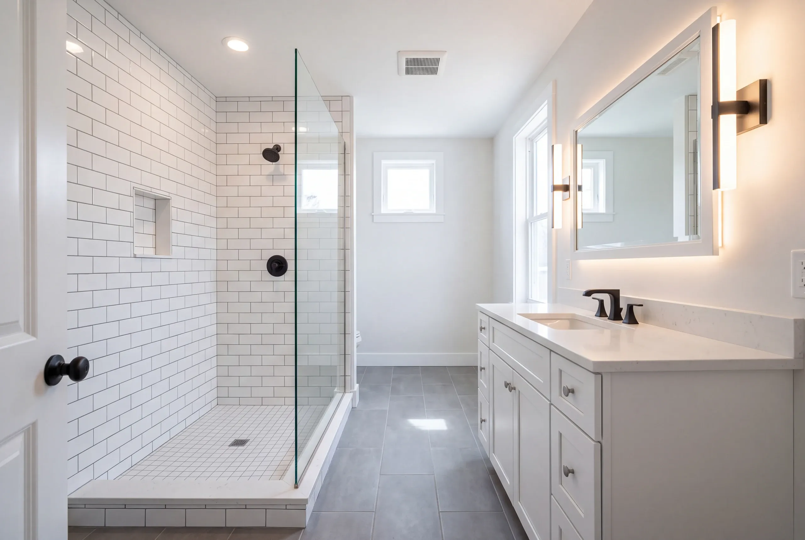 Finished Auburn bathroom with the vanity and tiled shower in view