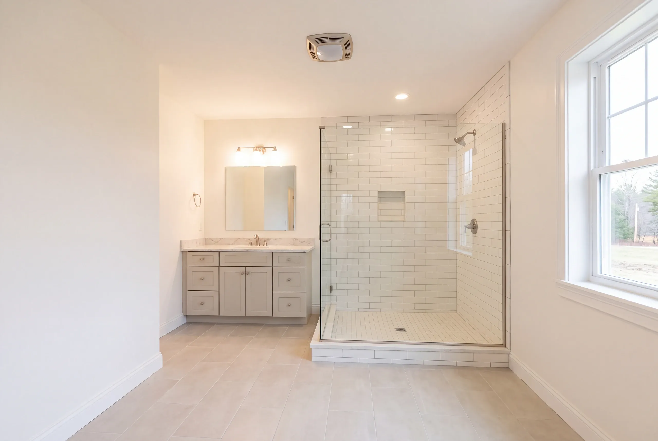 Finished bathroom in a Belgrade, Maine home, wide interior view