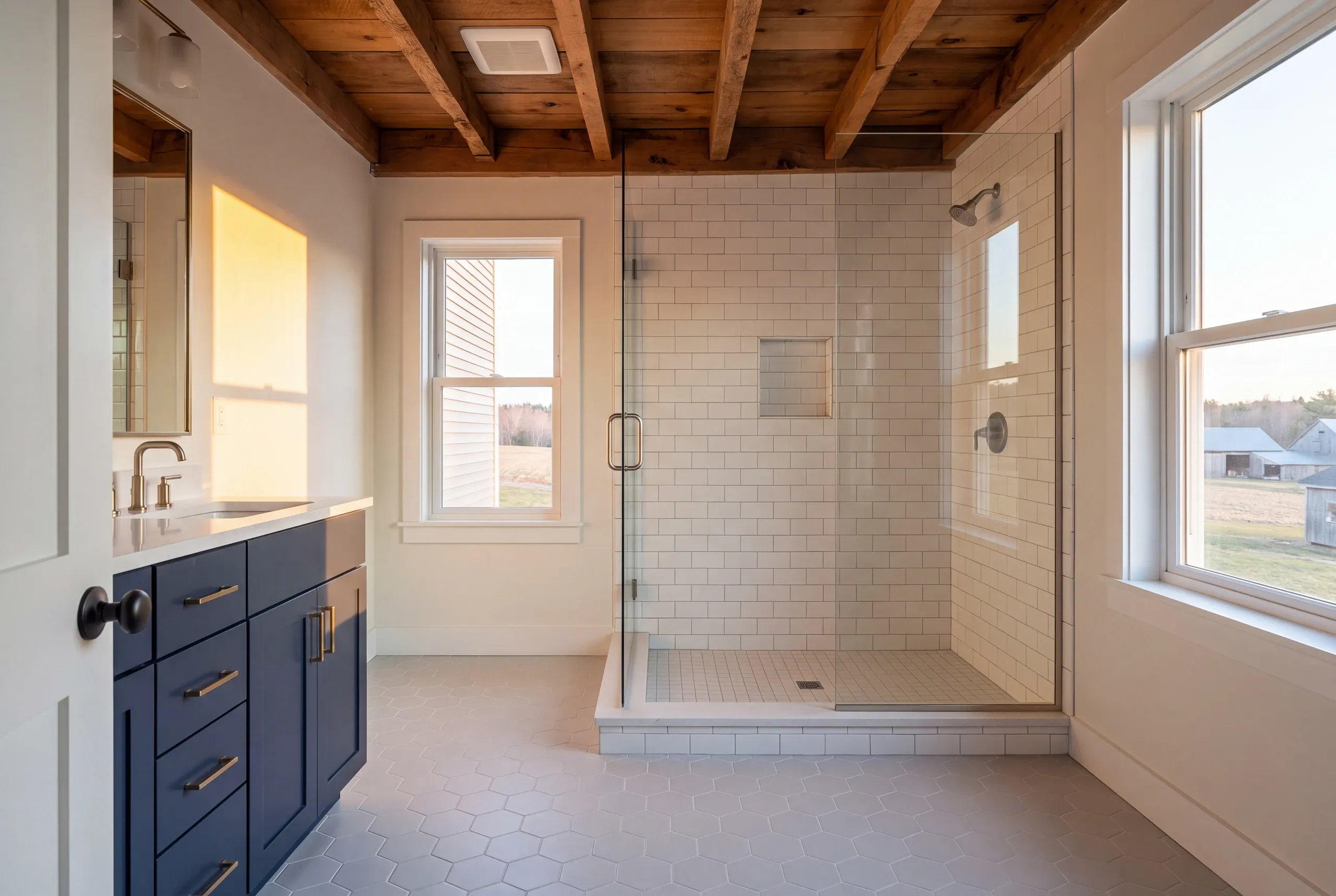 Clinton farmhouse bathroom opened to the joists with old venting exposed