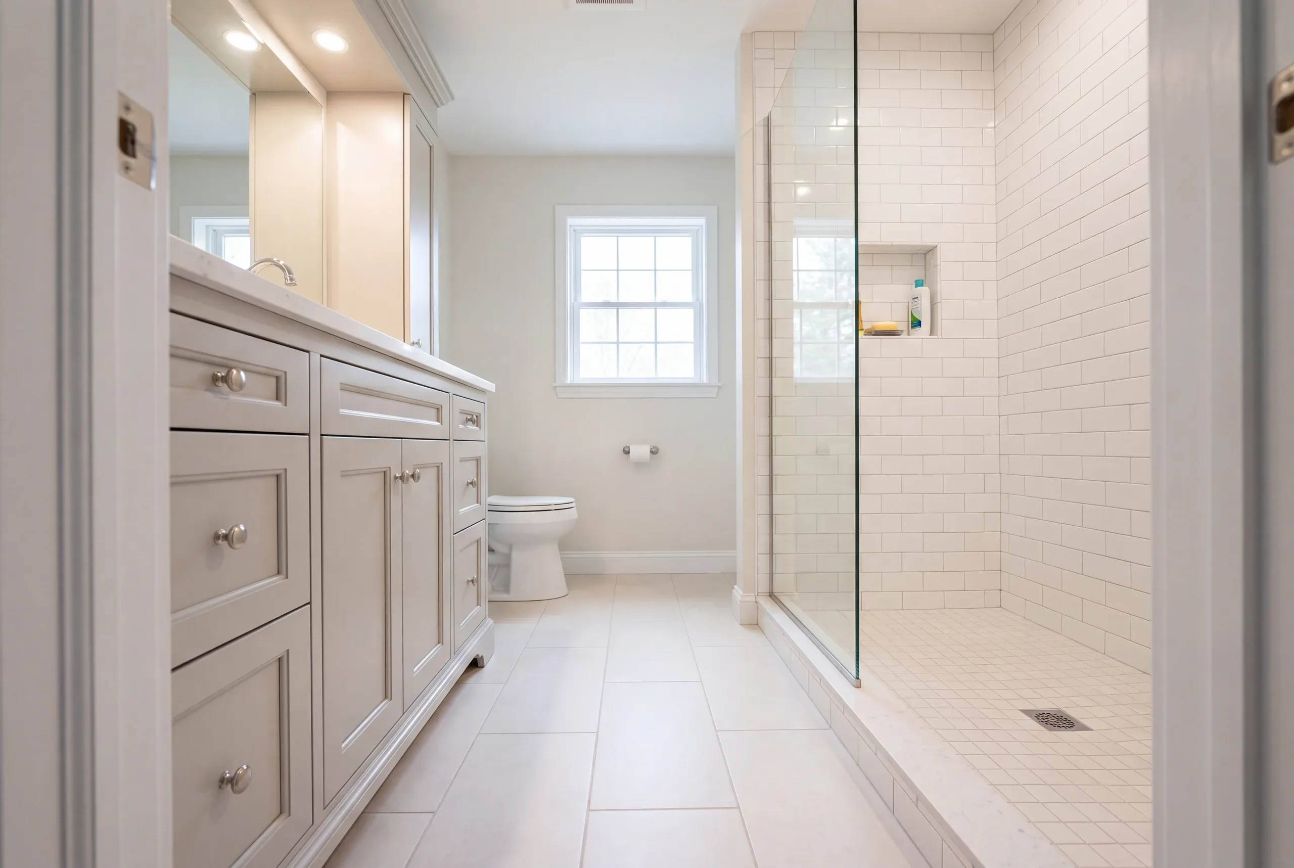Finished Farmington bathroom with the vanity and tiled shower in view