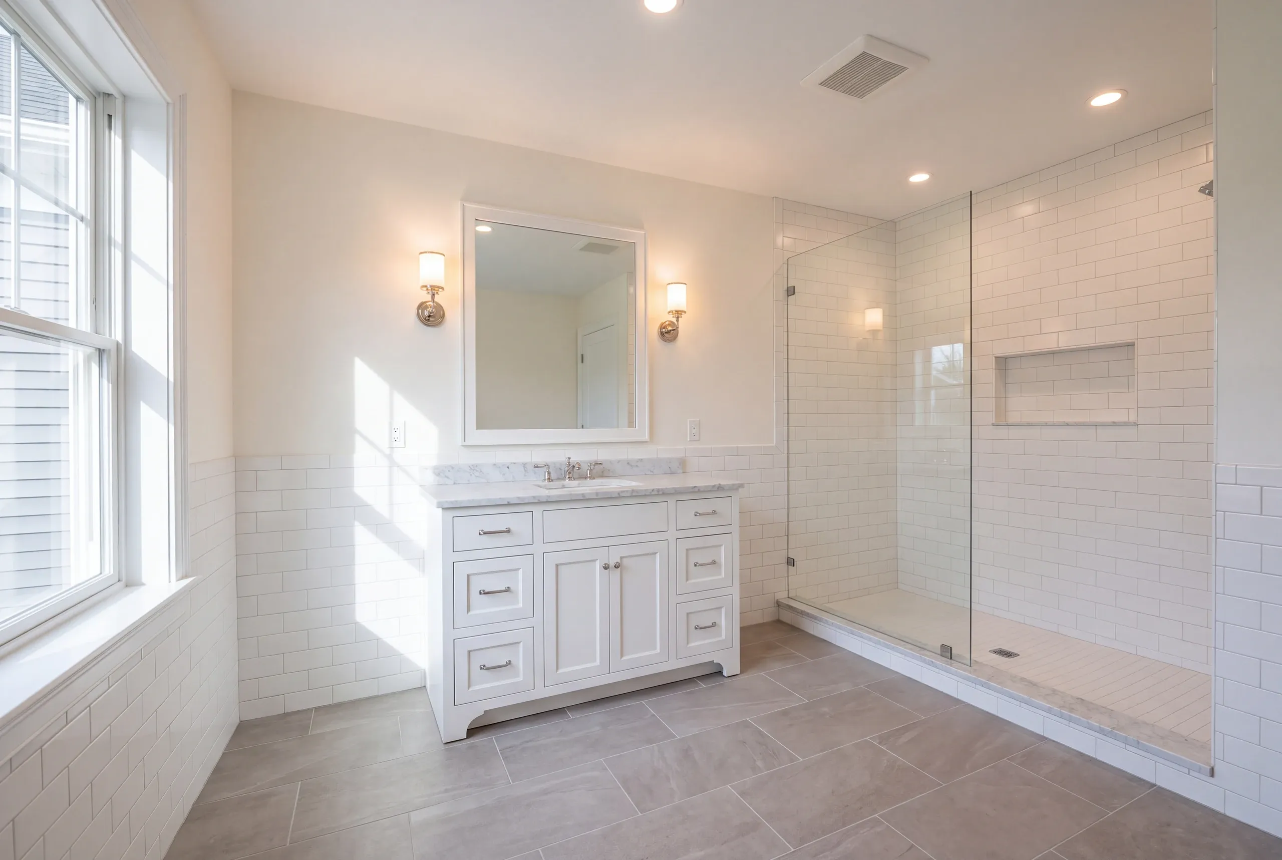 Finished bathroom with a custom vanity in a Maine home