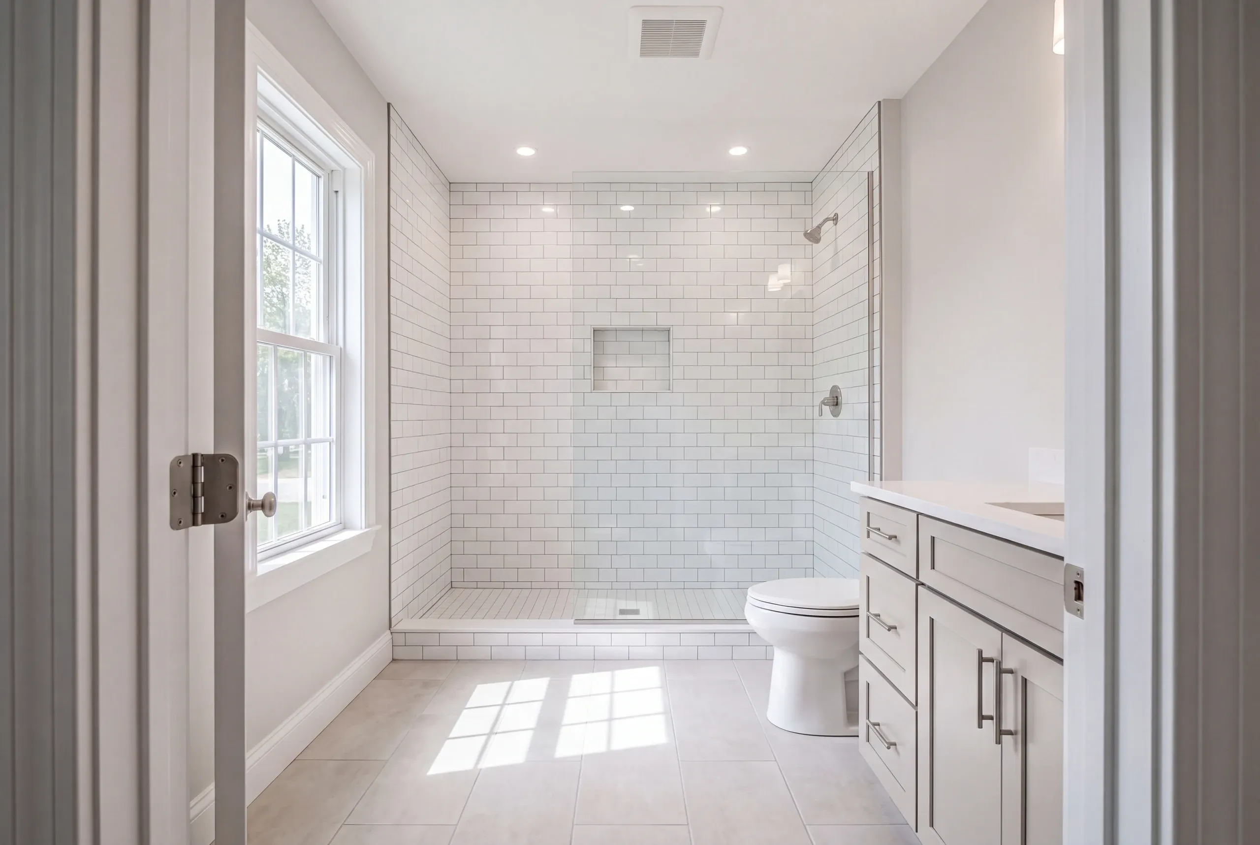 Finished bathroom with porcelain tile in a Lewiston multi-family unit