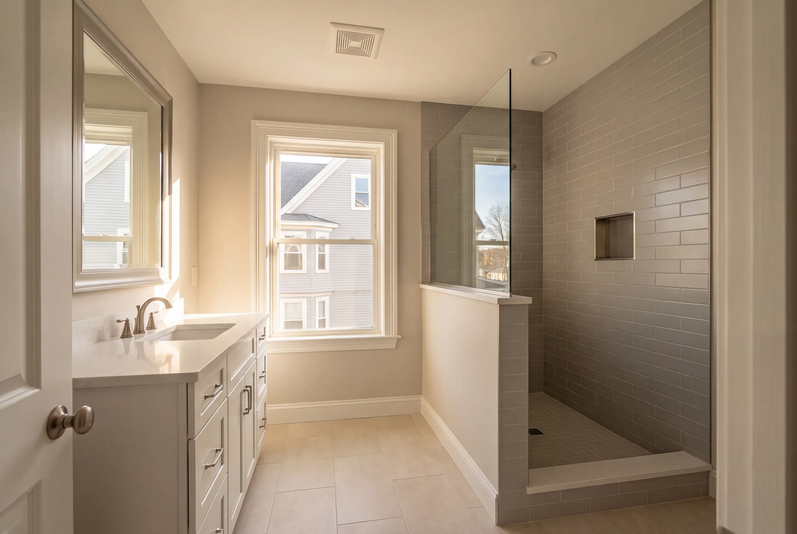 Finished Lewiston bathroom with the vanity and tiled shower in view