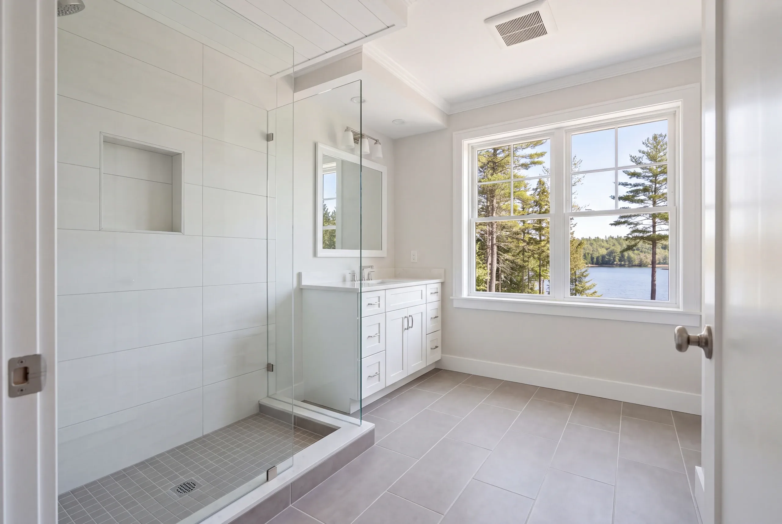 Finished bathroom with heated tile floor overlooking Long Pond in Mount Vernon