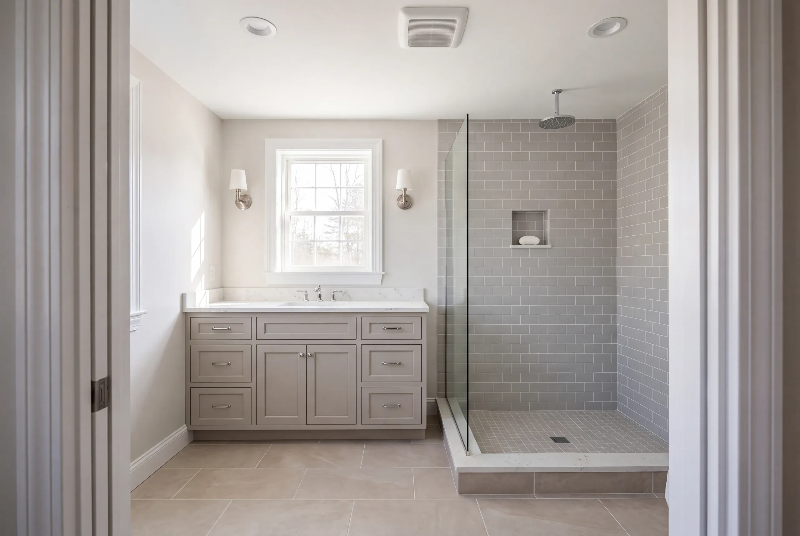 Finished Mt Vernon bathroom with the vanity and tiled shower in view
