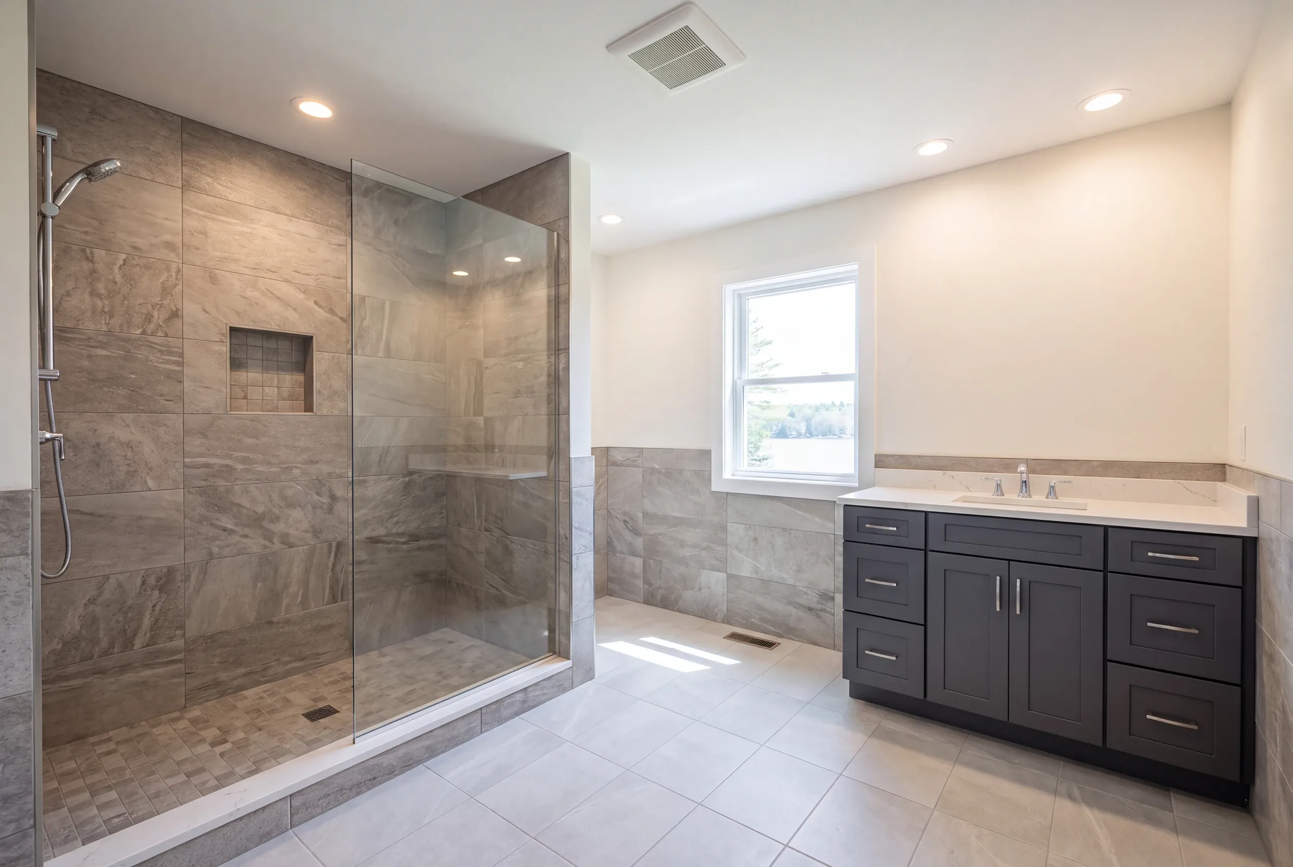 Finished four-season bathroom with heated floor in an Oakland lake home