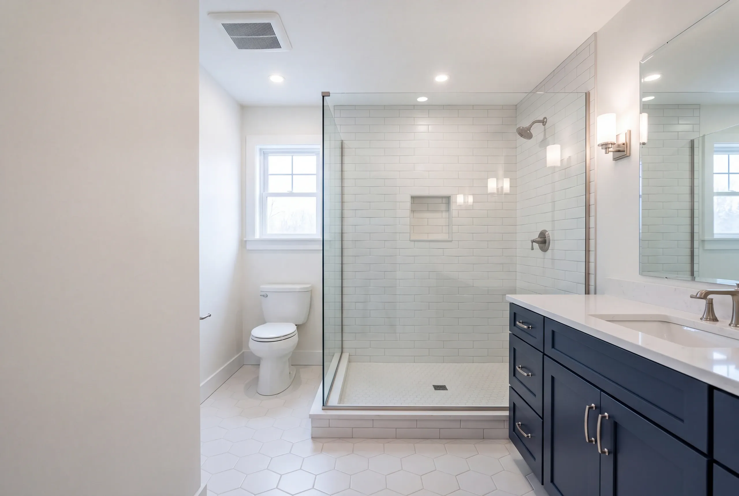 Finished bathroom in an Oakland, Maine home, wide interior view
