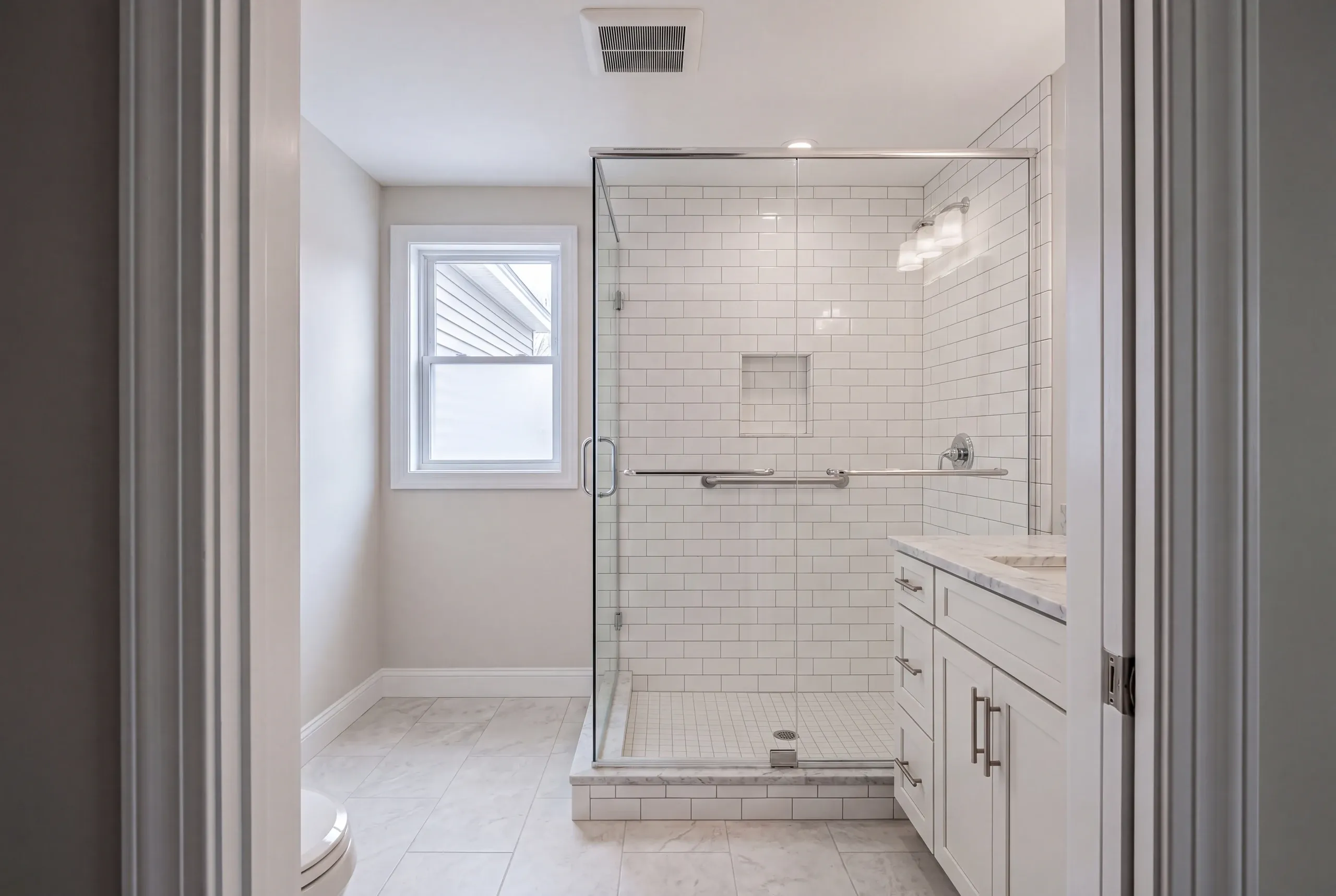 Water softener and pressure tank checked before a Sidney bathroom remodel