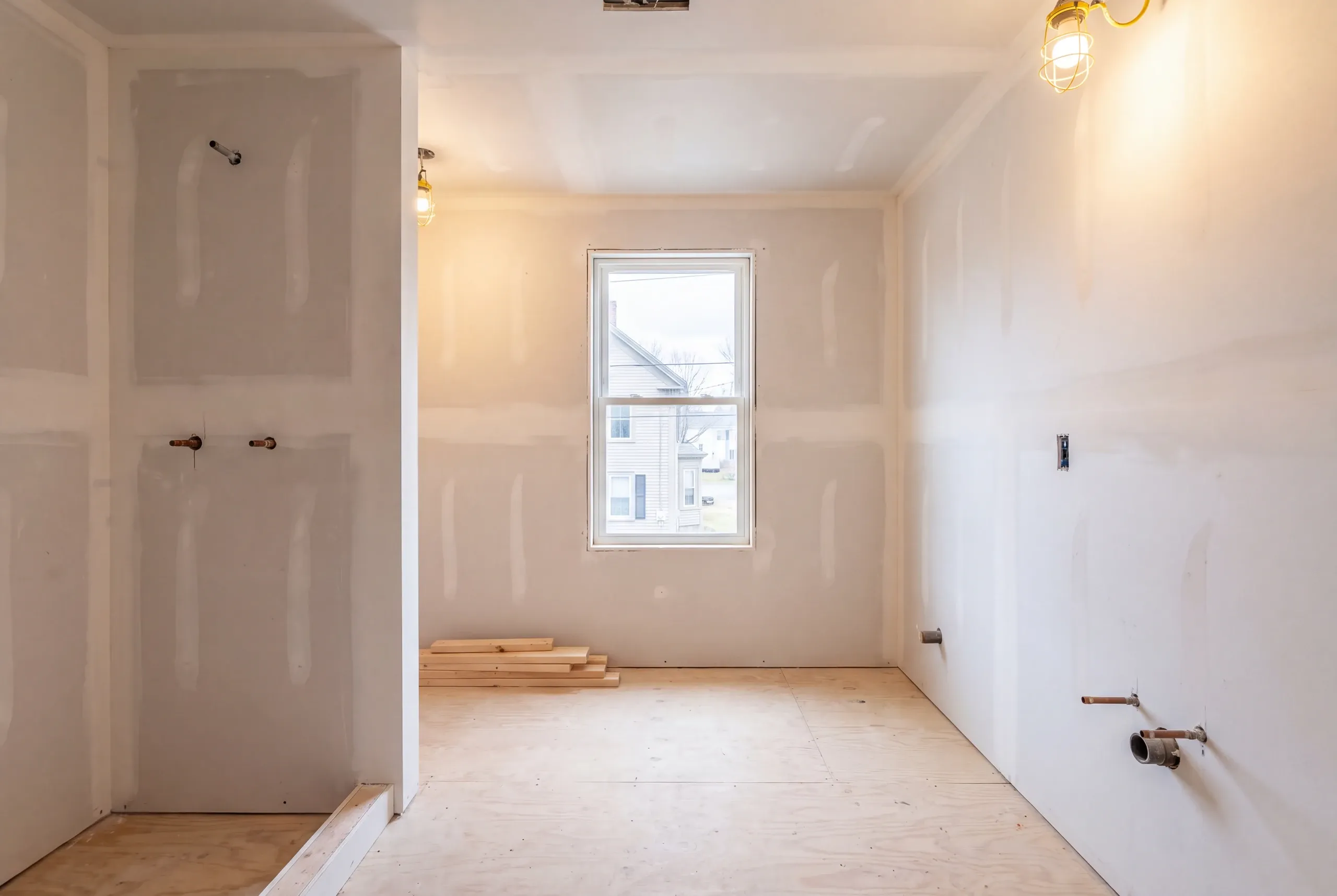 Penny tile floor being set in a period-appropriate Waterville bathroom
