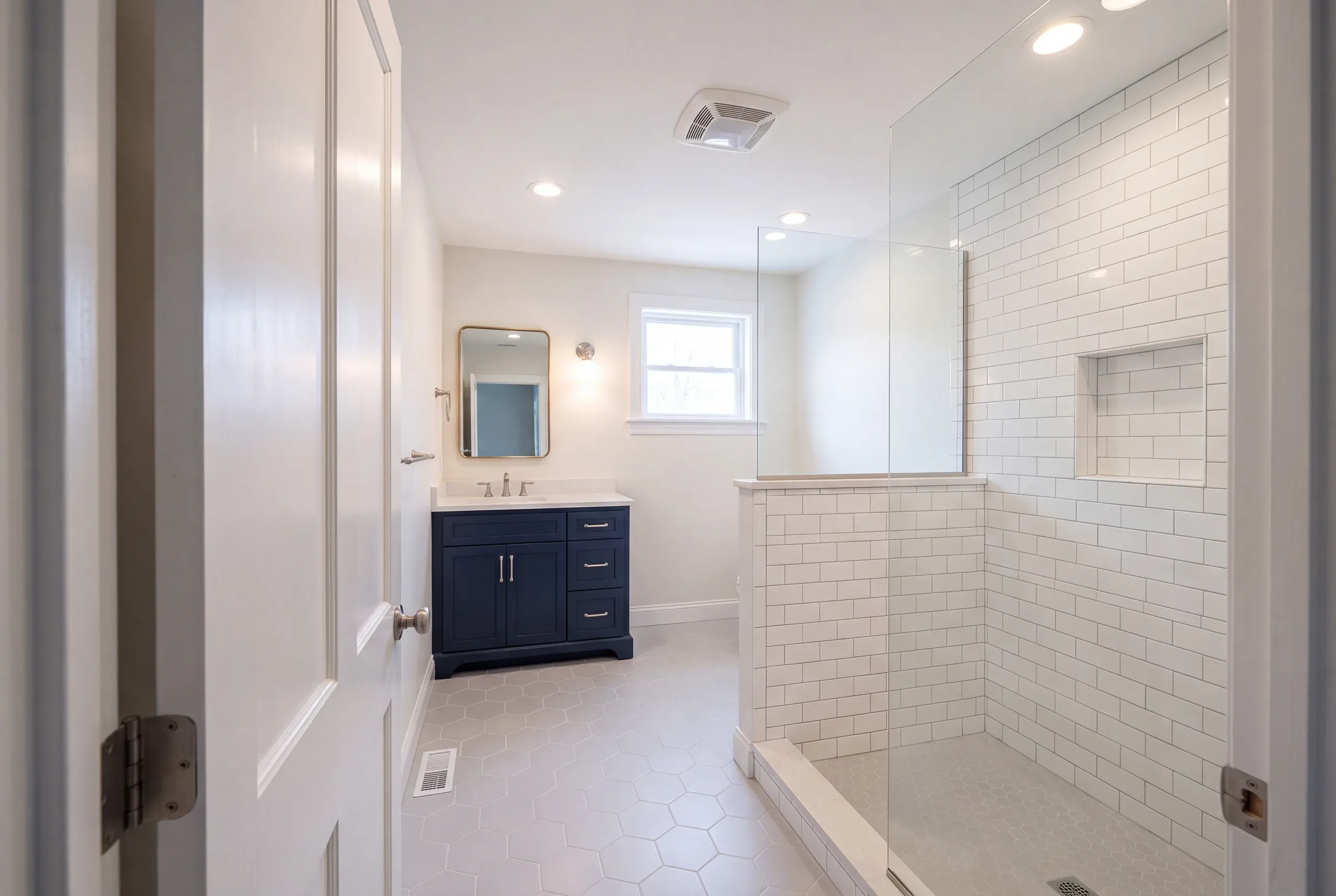 Finished bathroom in a Waterville, Maine home, wide interior view