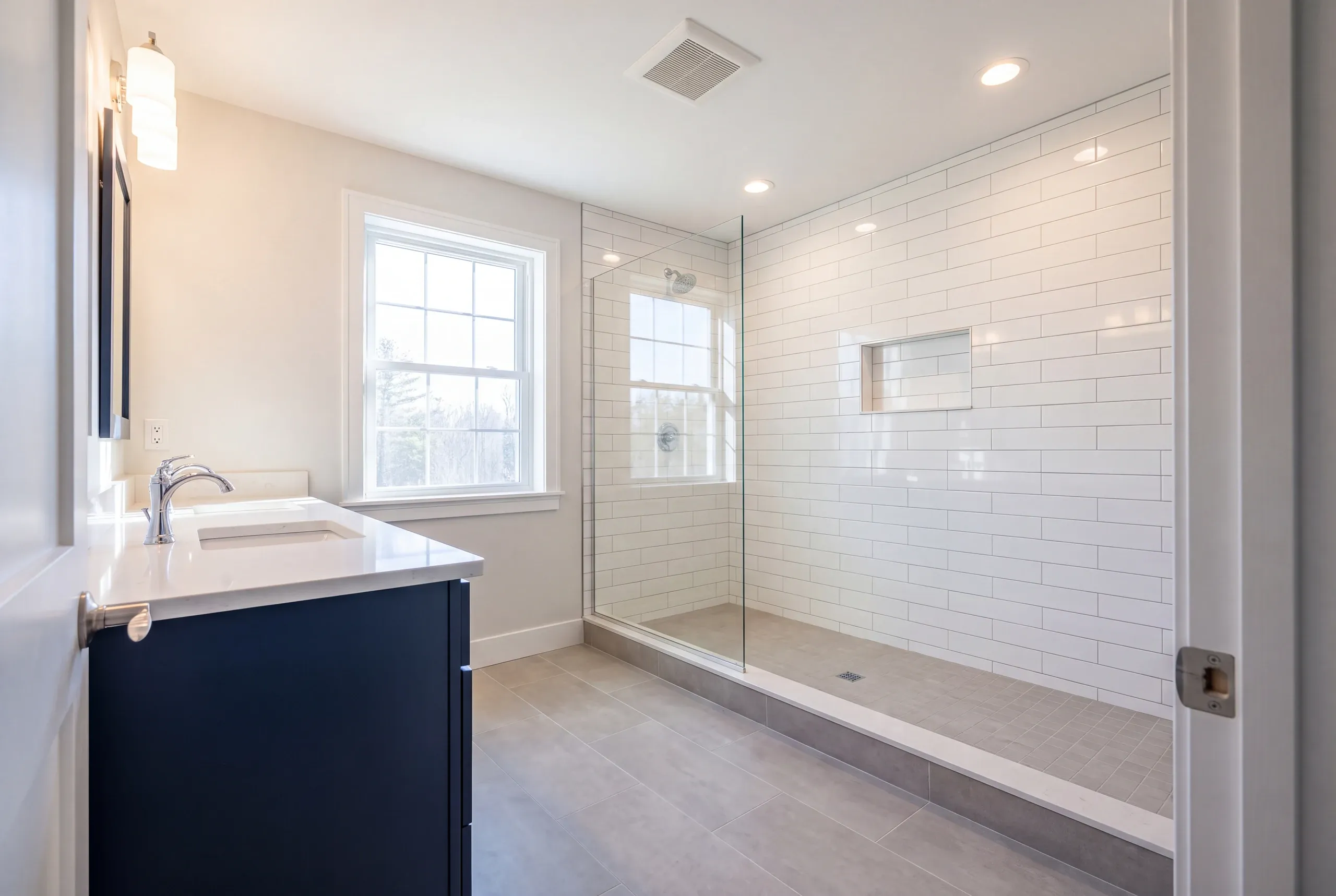 Finished Windsor bathroom with the vanity and tiled shower in view