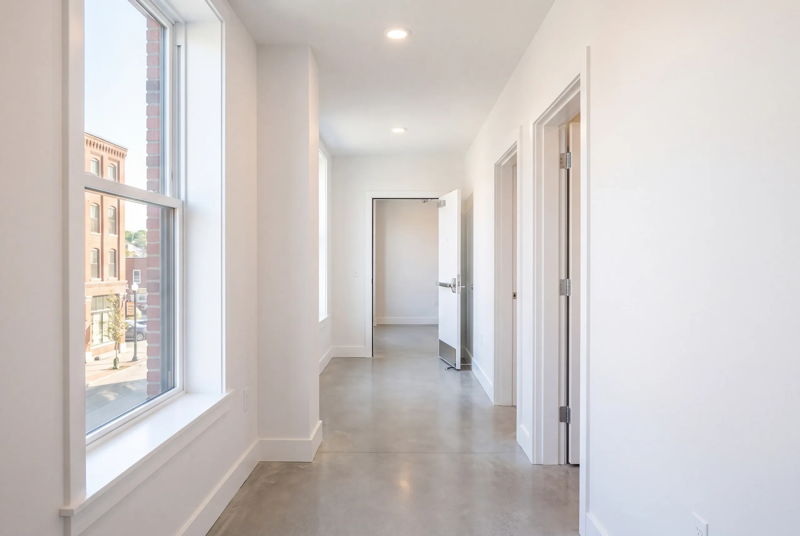 Rated corridor assembly framed in a Waterville apartment conversion