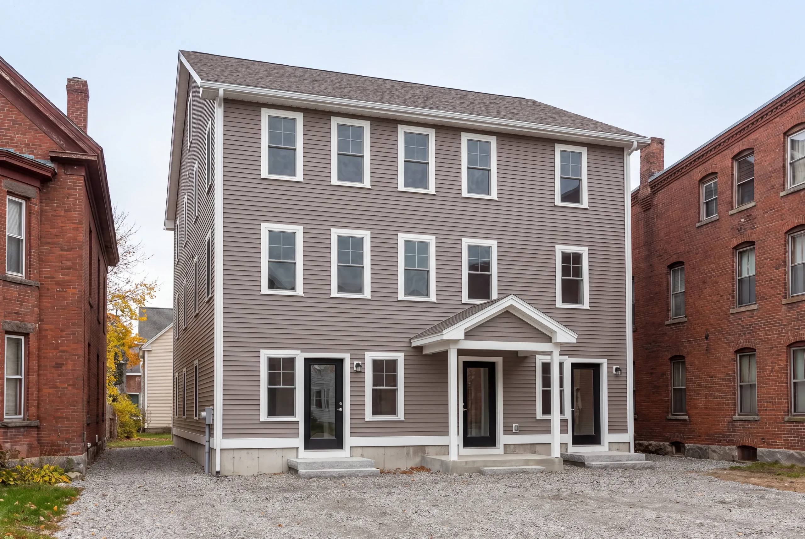New triplex under construction on a tight Waterville city lot