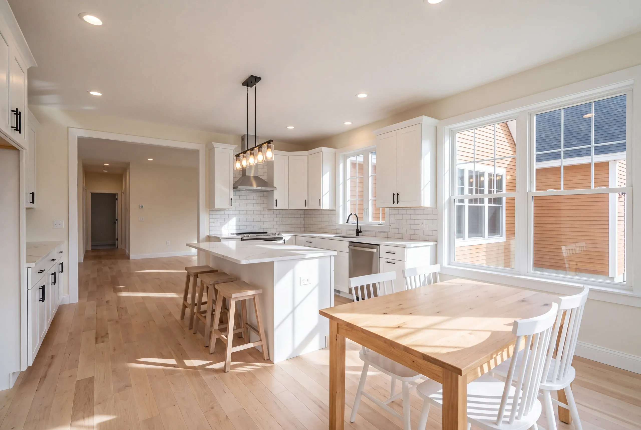 Open kitchen and dining area in a newly built Auburn home