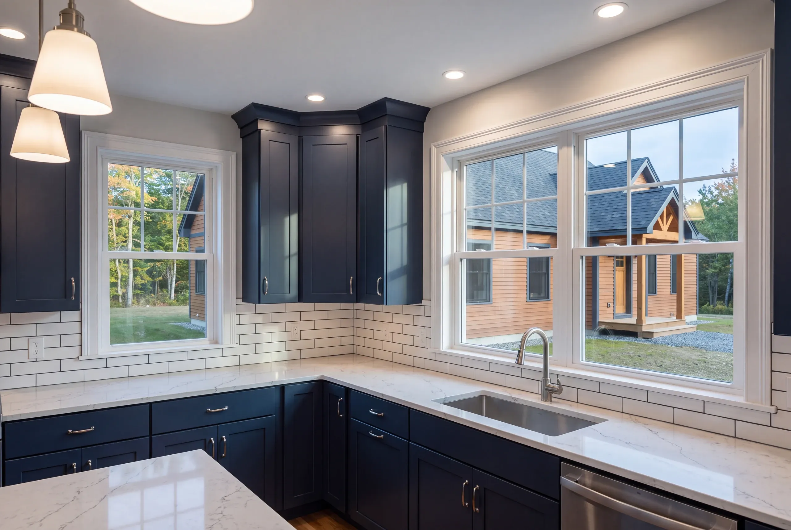 Farmhouse-style kitchen with painted cabinetry in a new Gardiner home