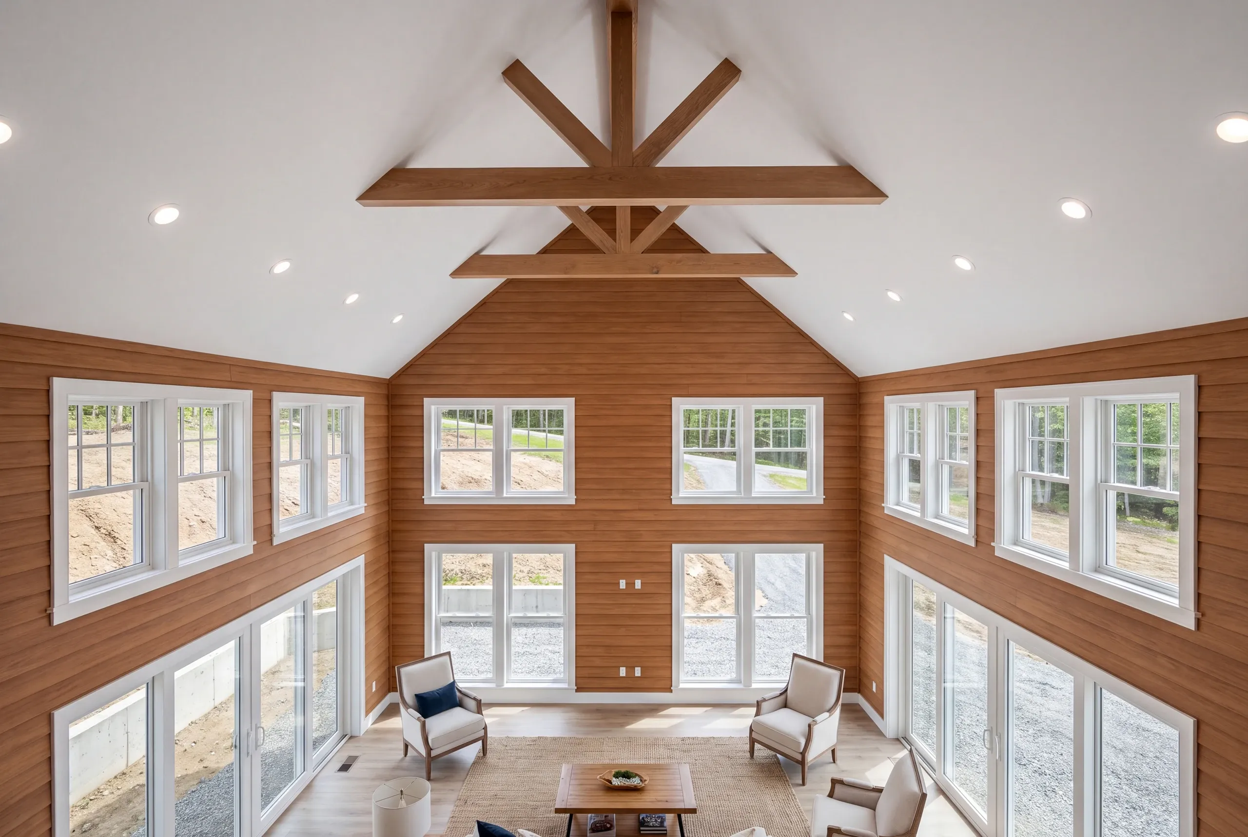 Living room with cathedral ceiling in a newly completed Winslow home