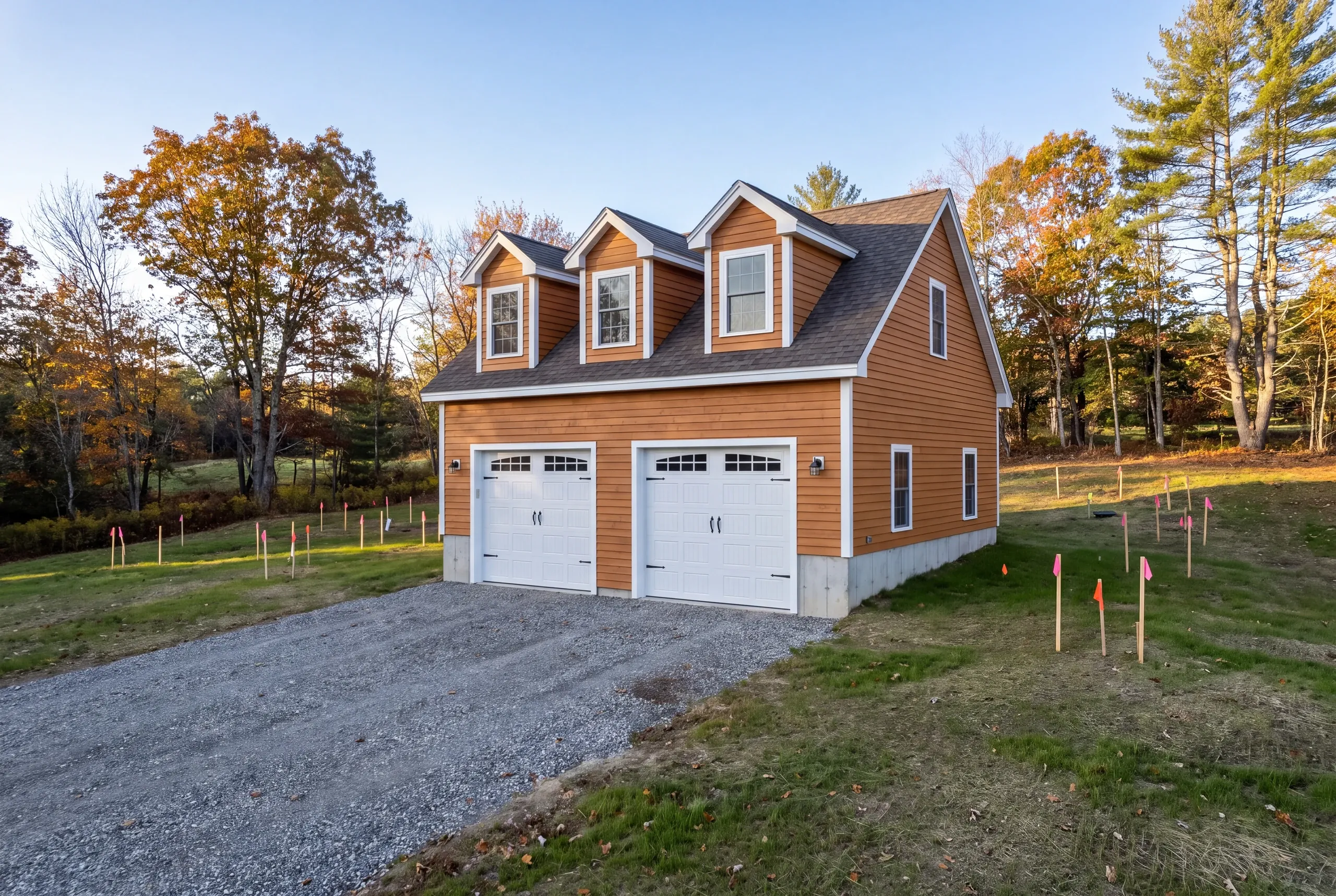 Septic field flagged before staking a garage footprint in Greene, Maine