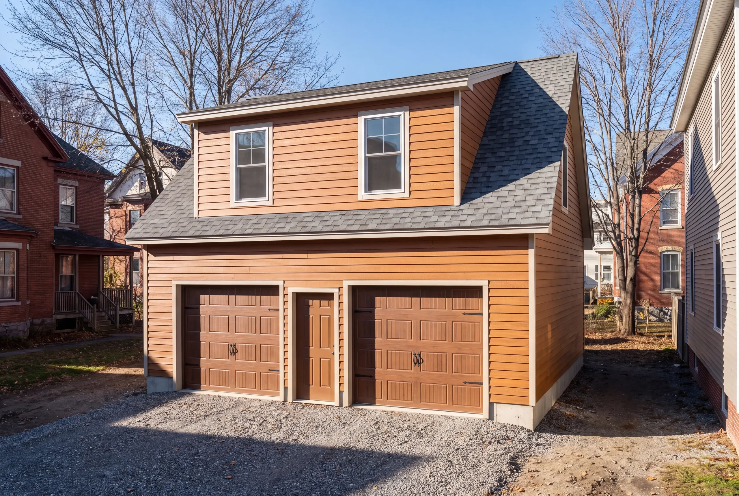 Garage builder Waterville, ME crew setting a detached garage on a narrow downtown lot