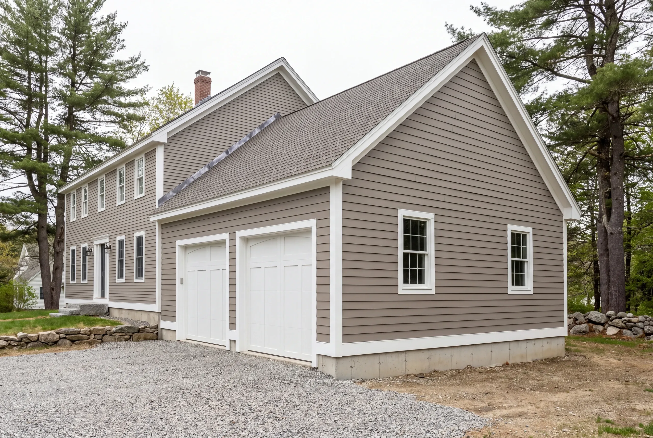 Wide gravel apron and turning space laid out for a Windsor garage addition