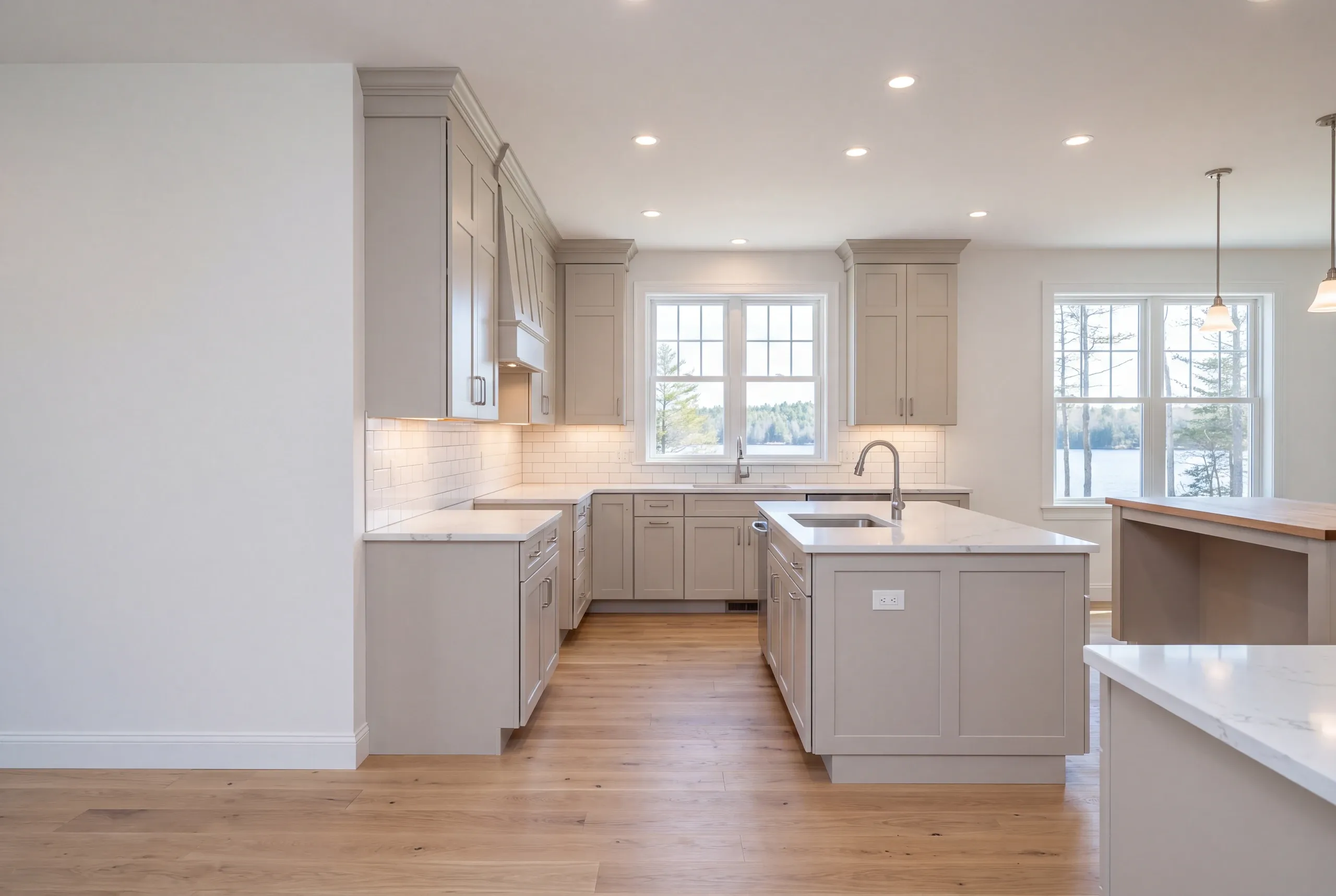 Finished kitchen in a Belgrade, Maine home, wide interior view
