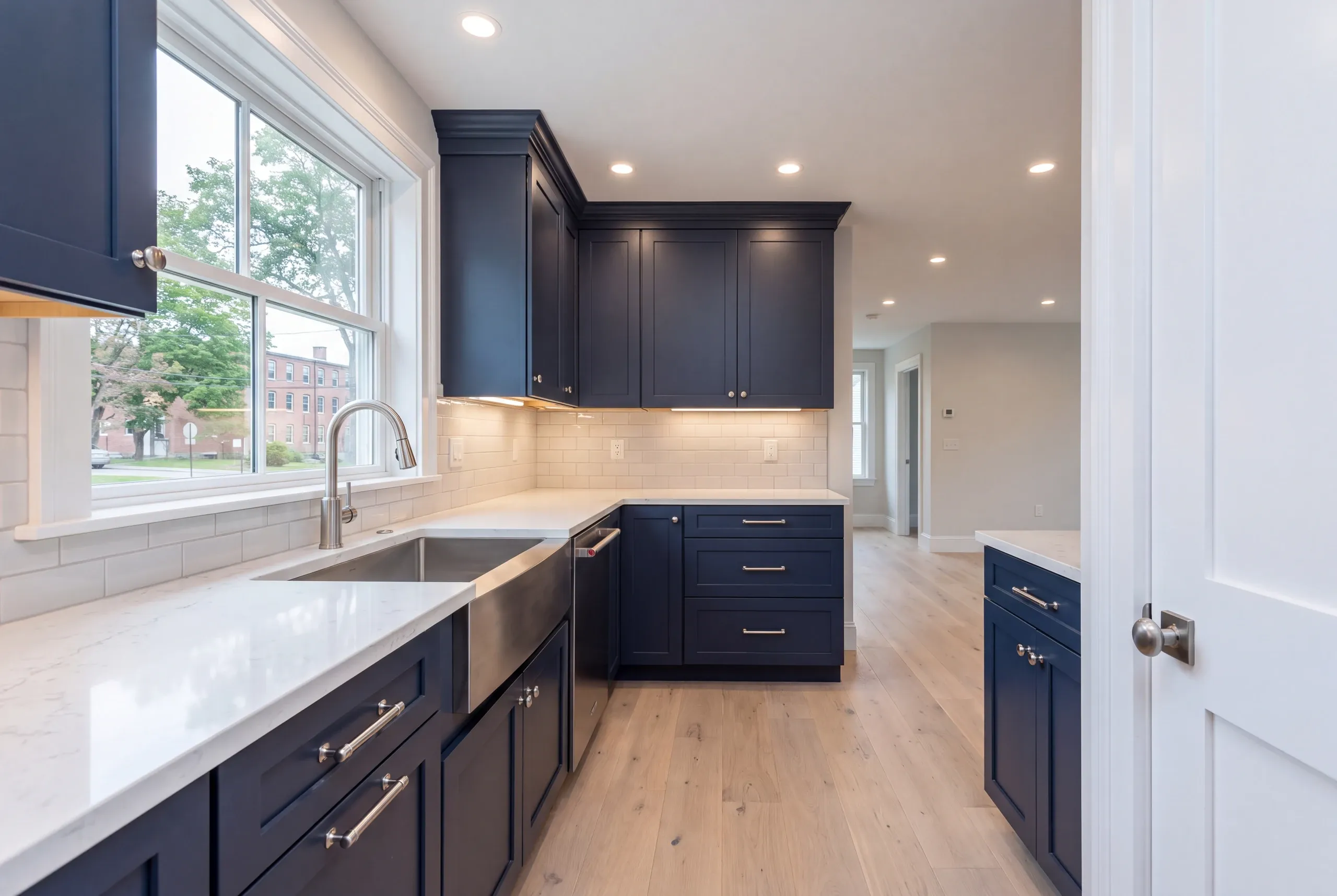 Stainless hardware chosen for salt air exposure in a Brunswick coastal kitchen