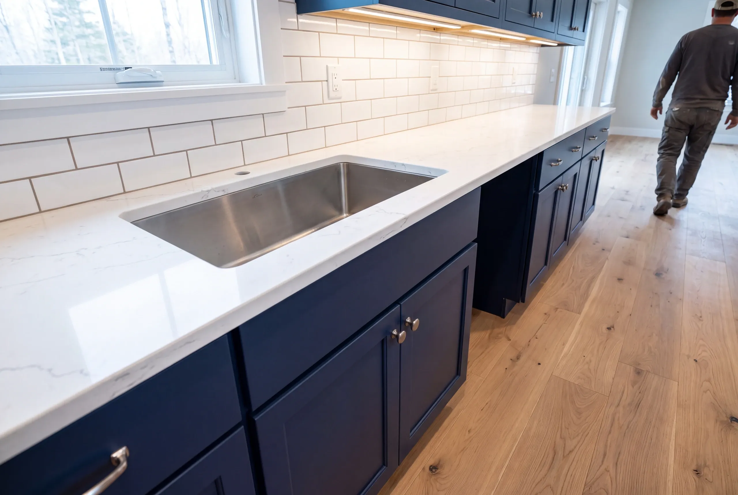 Deep single bowl stainless sink set in a Clinton farm kitchen counter