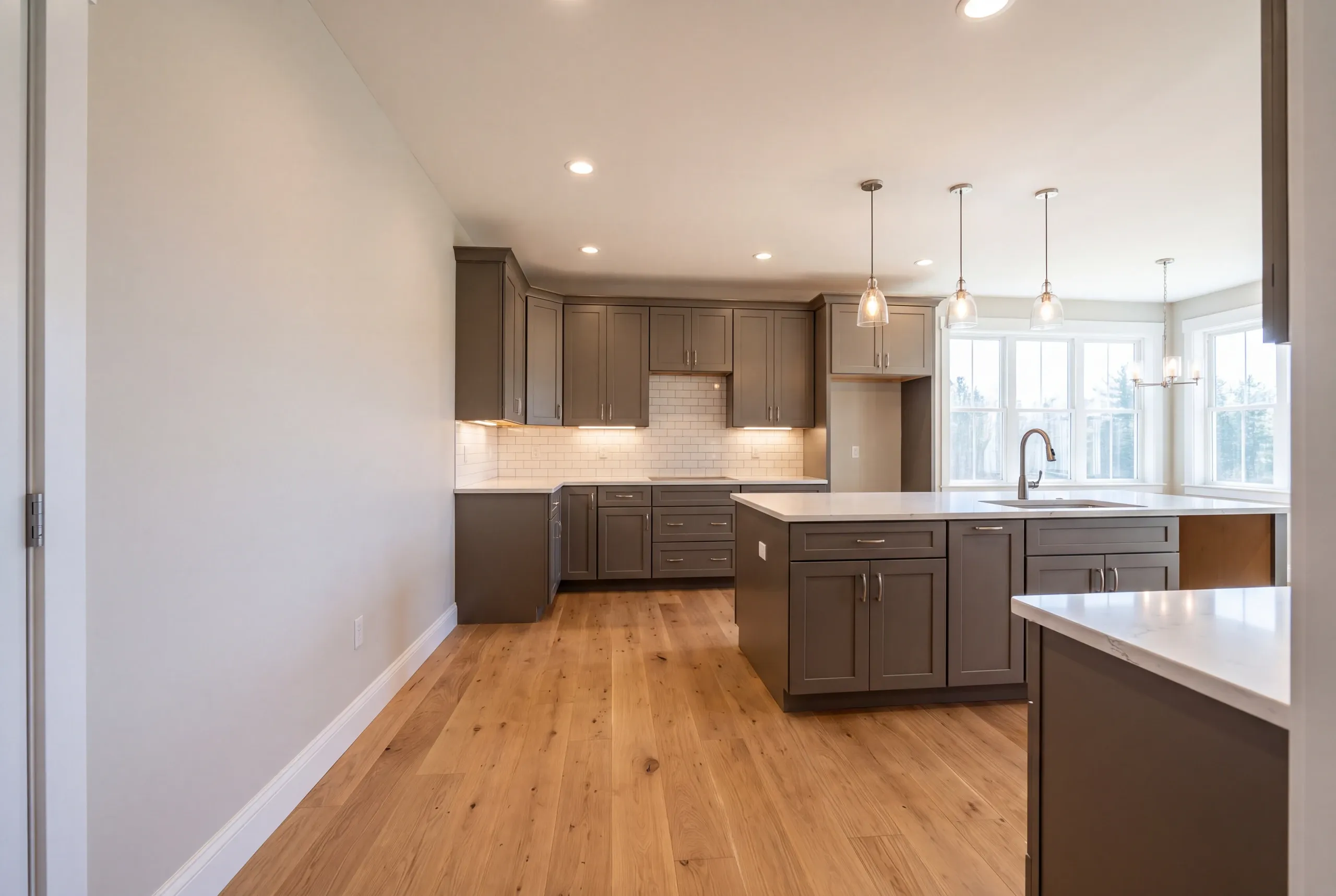 Finished kitchen in a Central Maine home, wide interior view