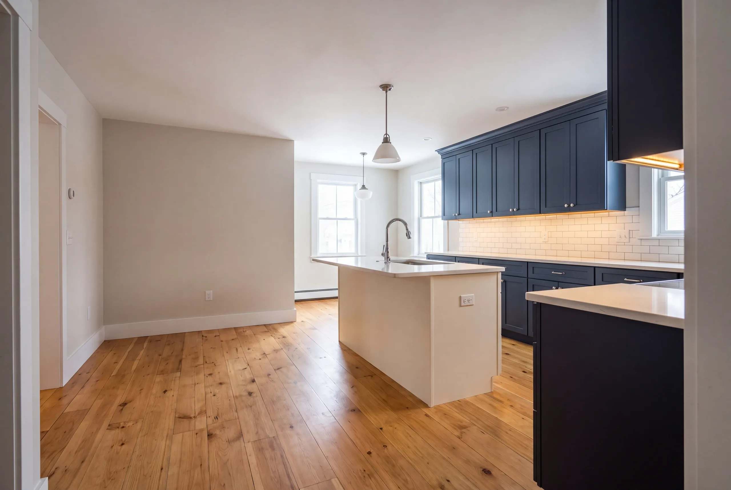 Finished kitchen in a Farmington, Maine home, wide interior view