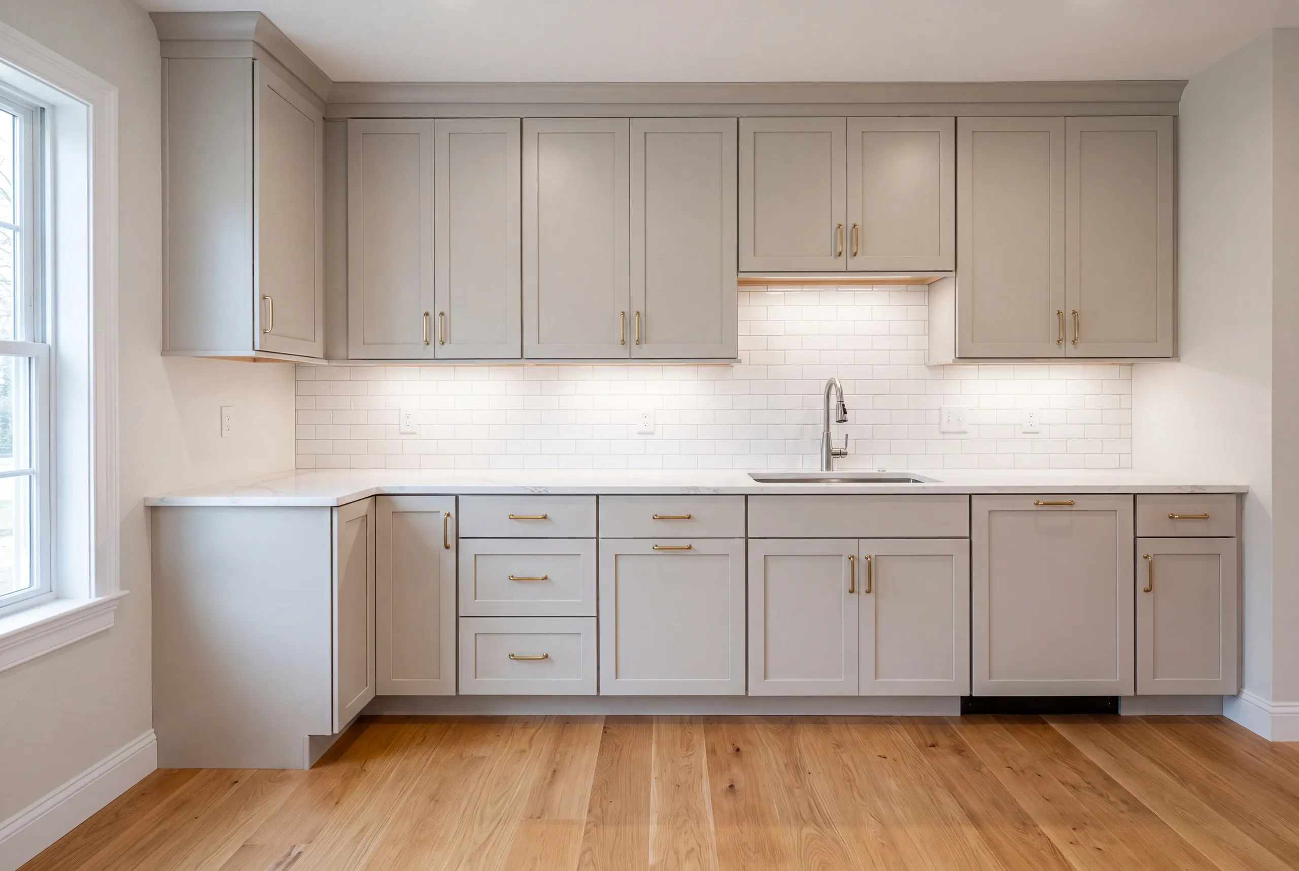 Three layers of old flooring exposed during a Gardiner kitchen demolition