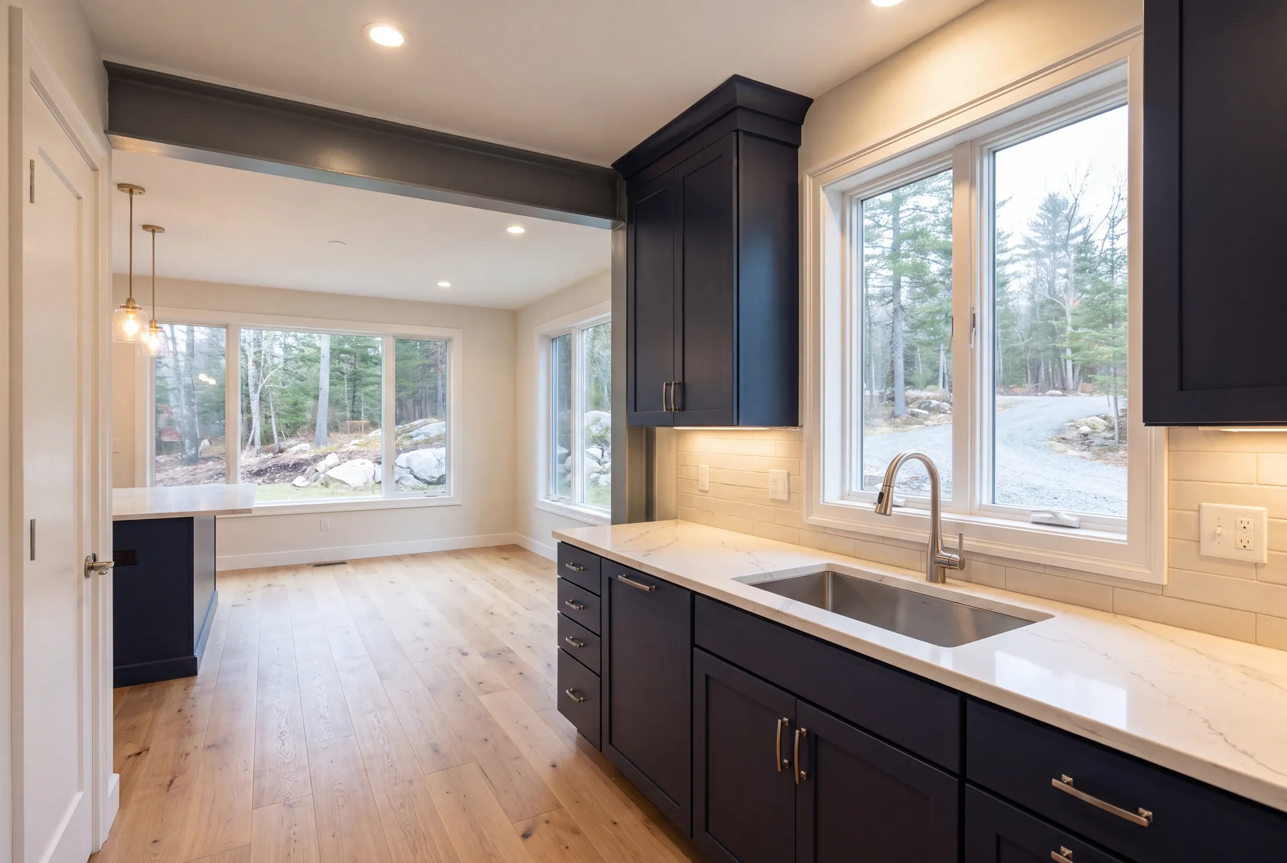 Load-bearing wall opened with a beam between a kitchen and dining room