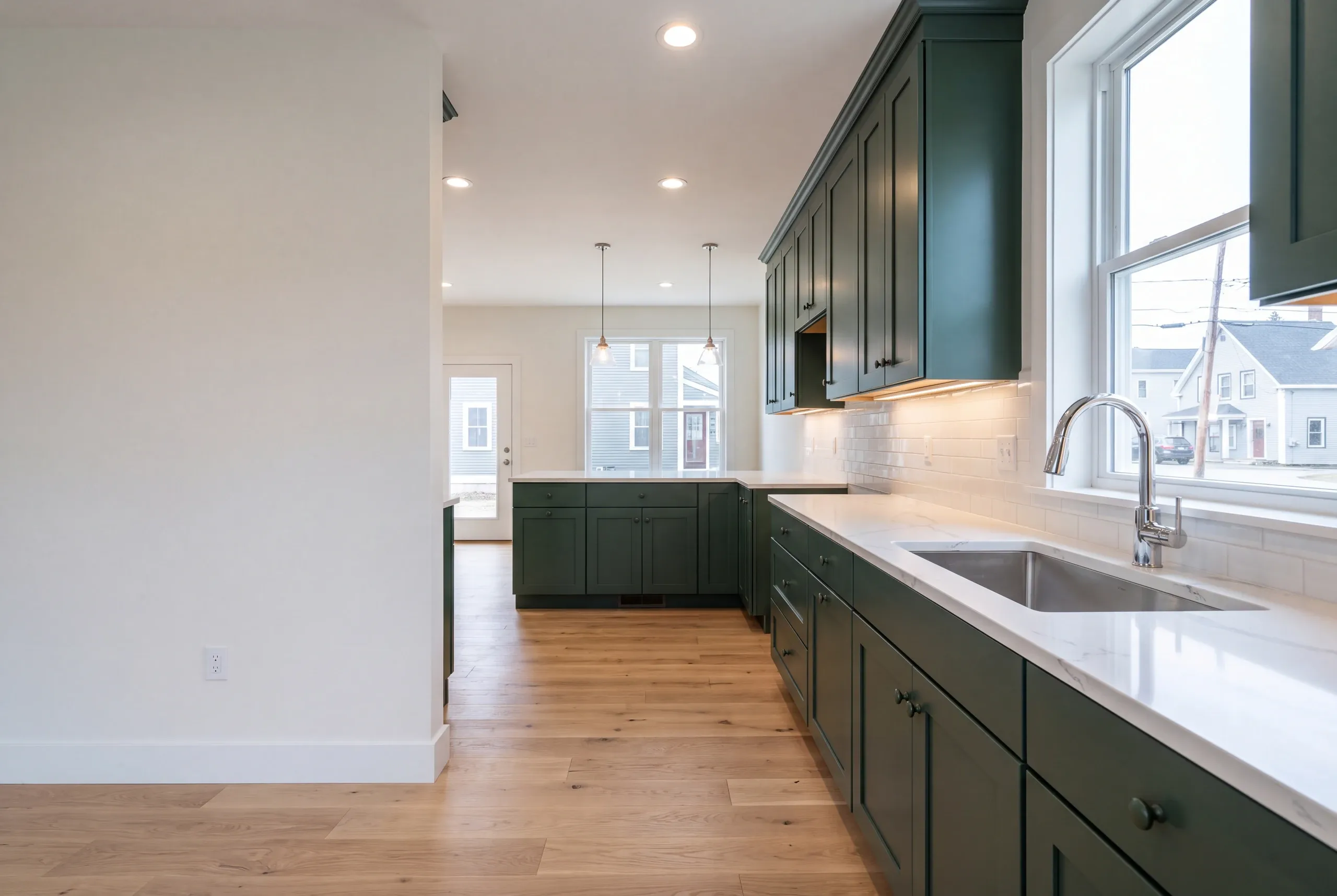 Finished kitchen in an Oakland, Maine home, wide interior view