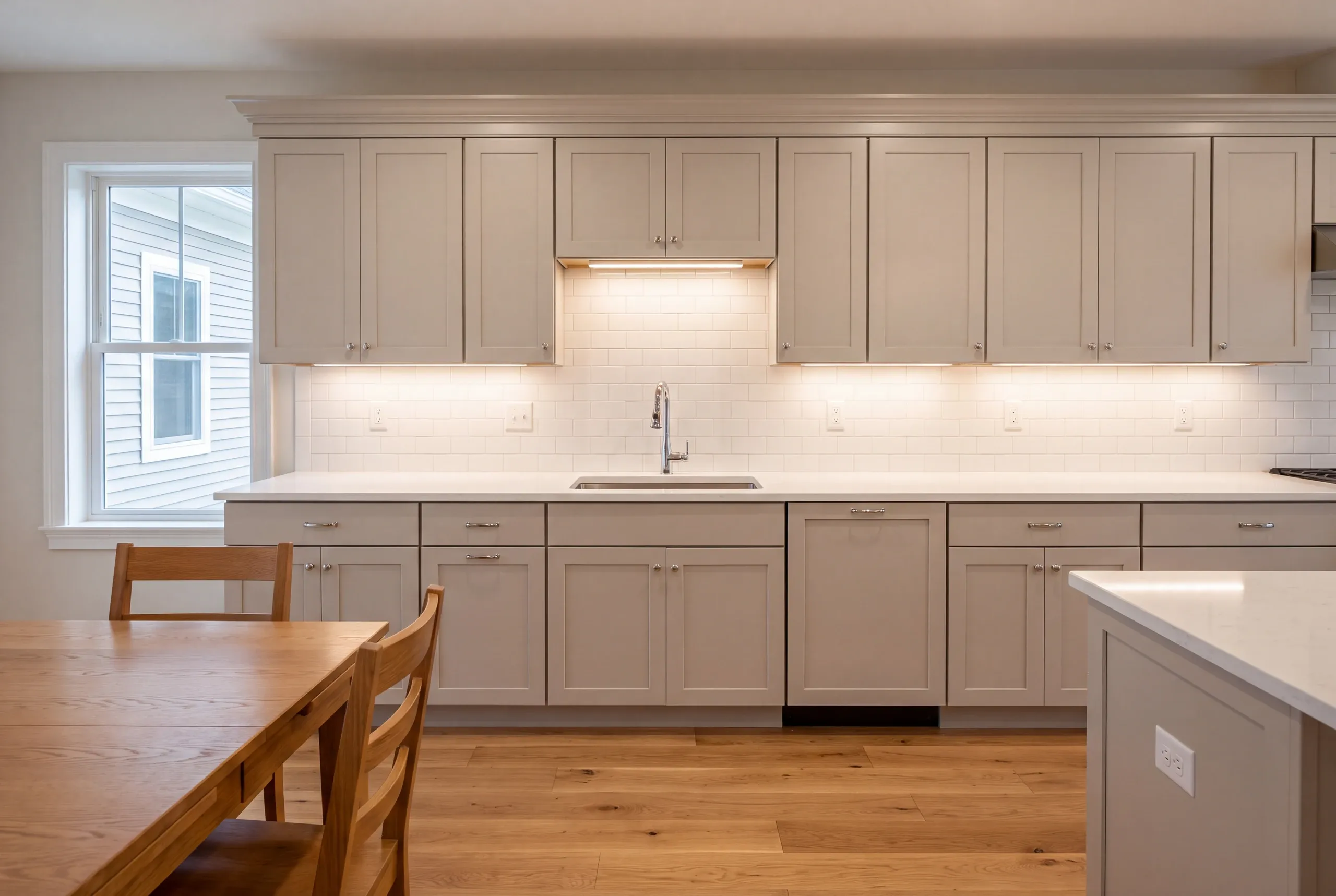 Finished Vassalboro kitchen seen from the adjoining dining area