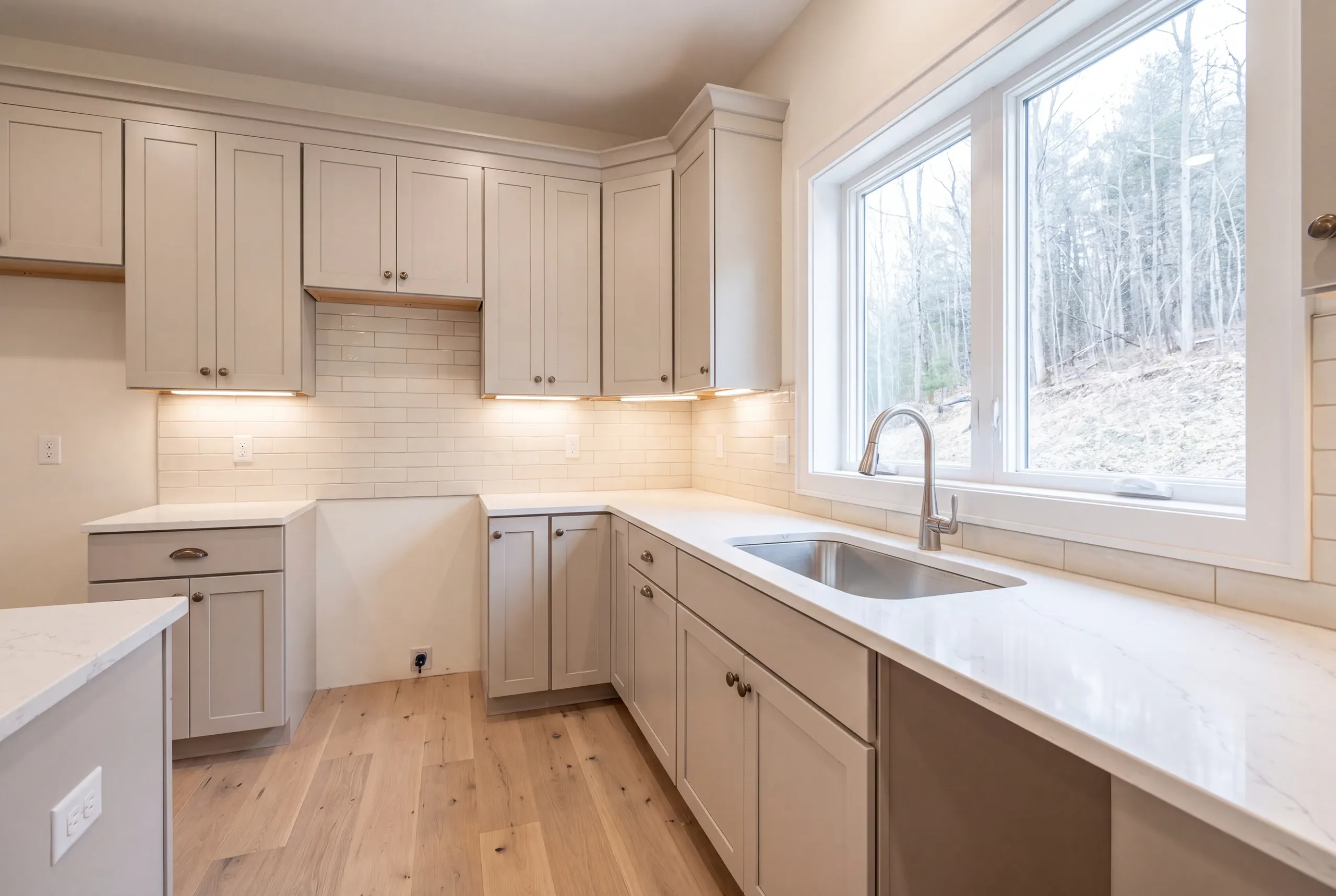 Builder reviewing well and septic locations at a Vienna kitchen project