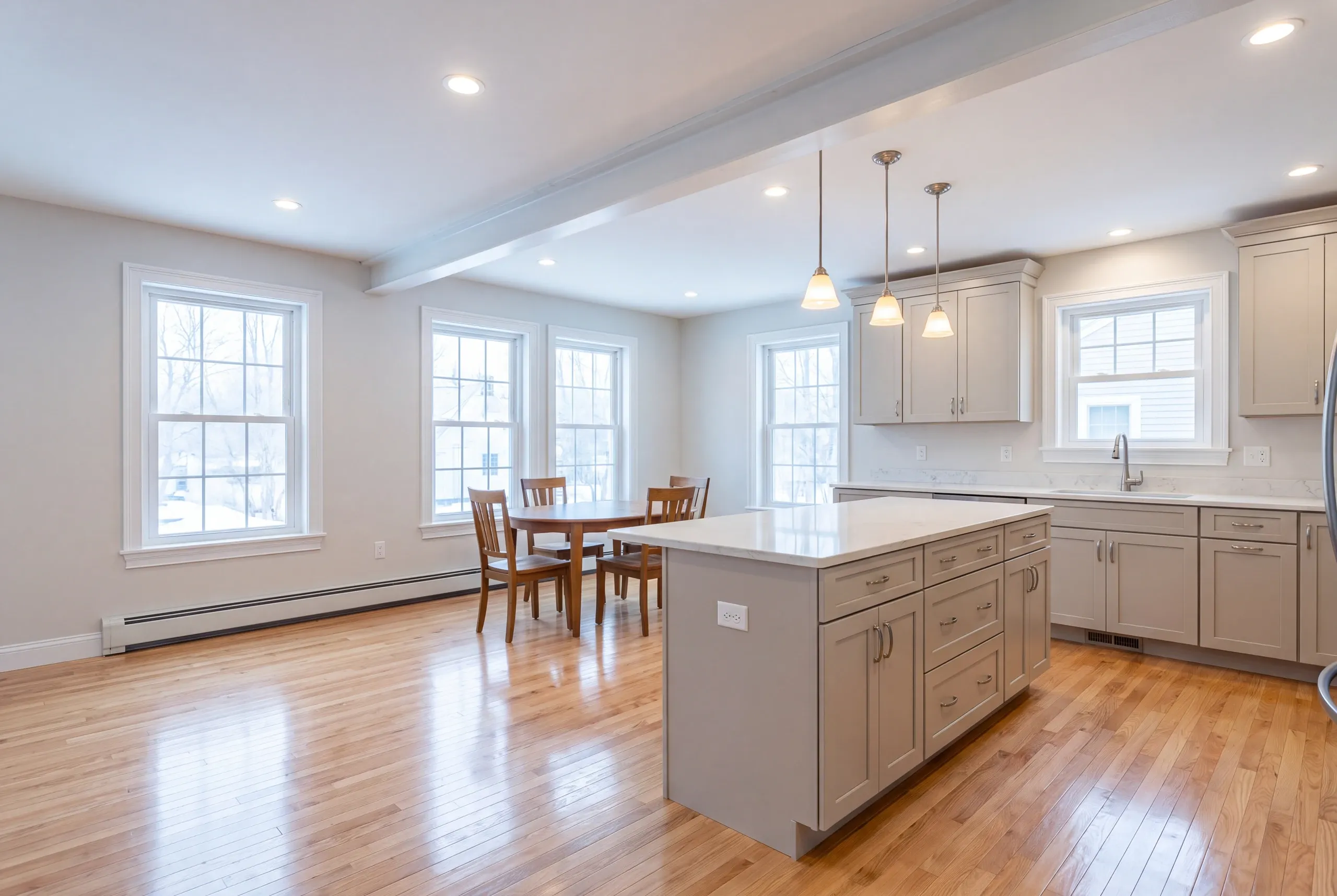 Finished open kitchen and dining space in a remodeled Augusta home