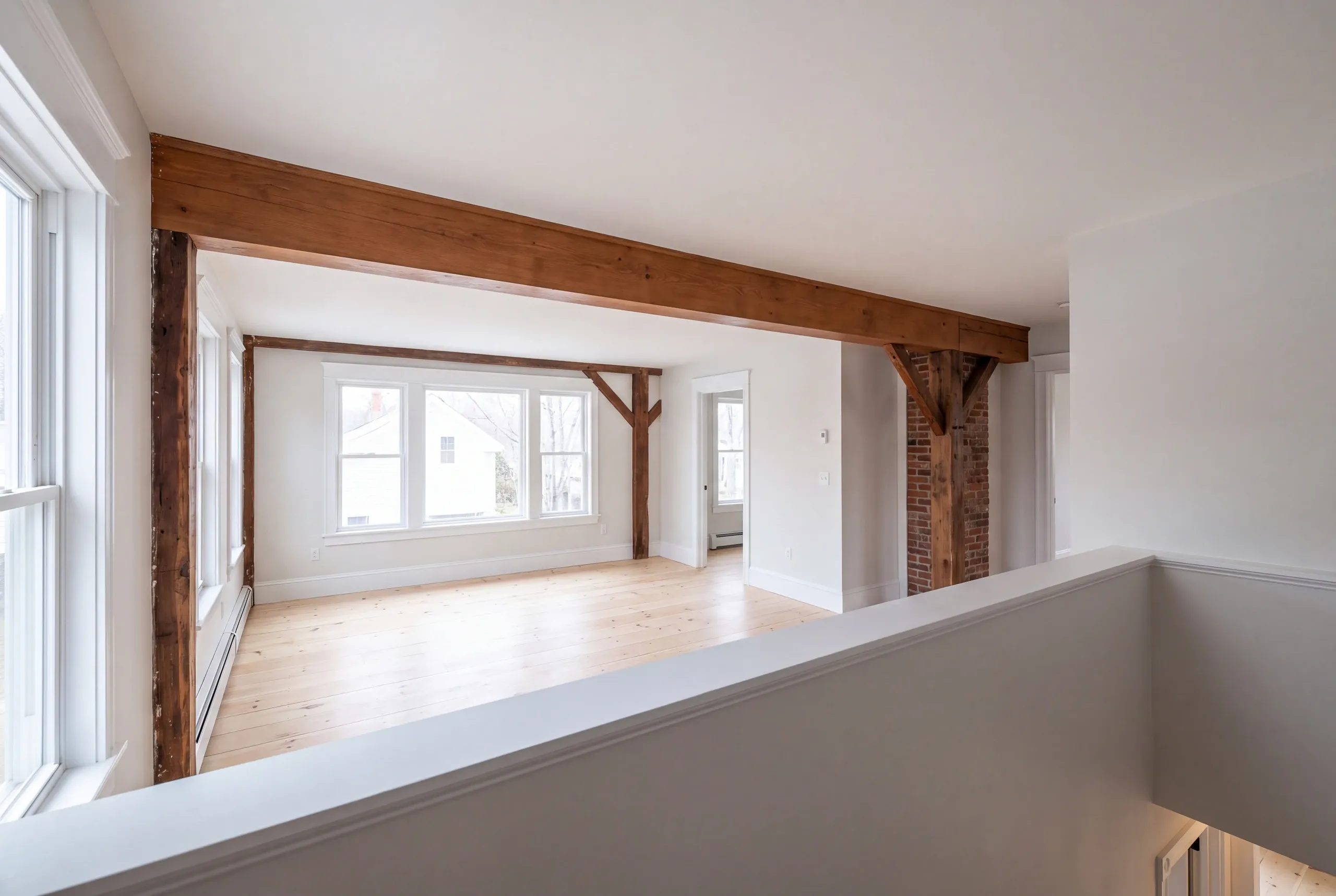 Builder reviewing two building eras in one Brunswick house