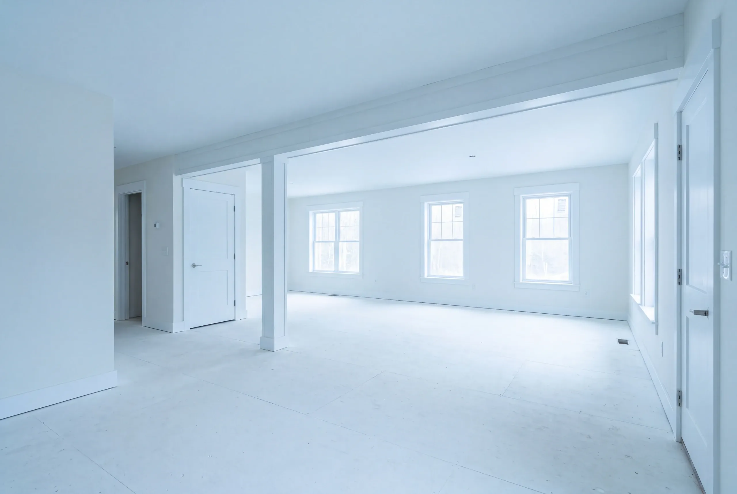 Builder measuring room sizes in a Fairfield farmhouse