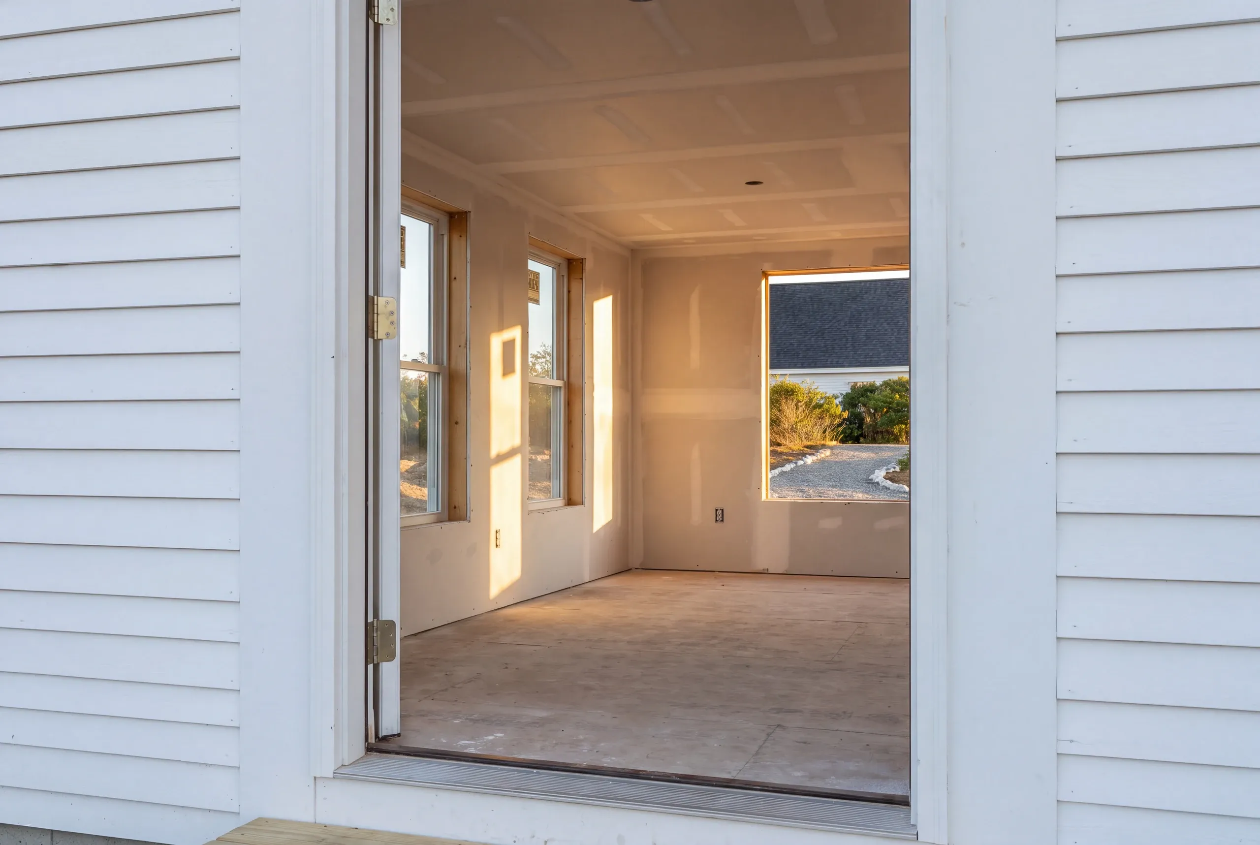 Crew replacing plaster with board in a nineteenth century Gardiner house