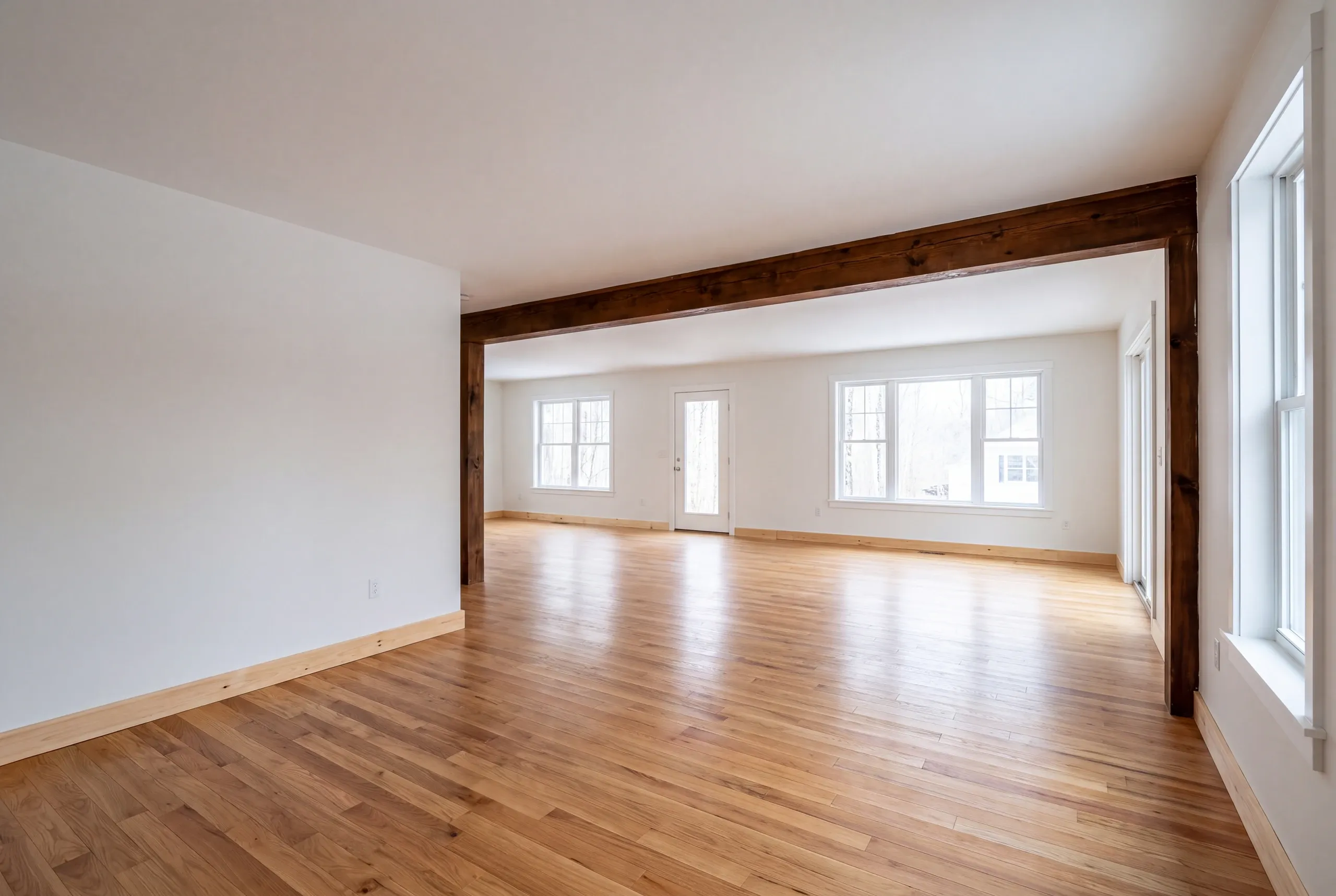 Finished renovated living space in a Gardiner, Maine home, wide interior view