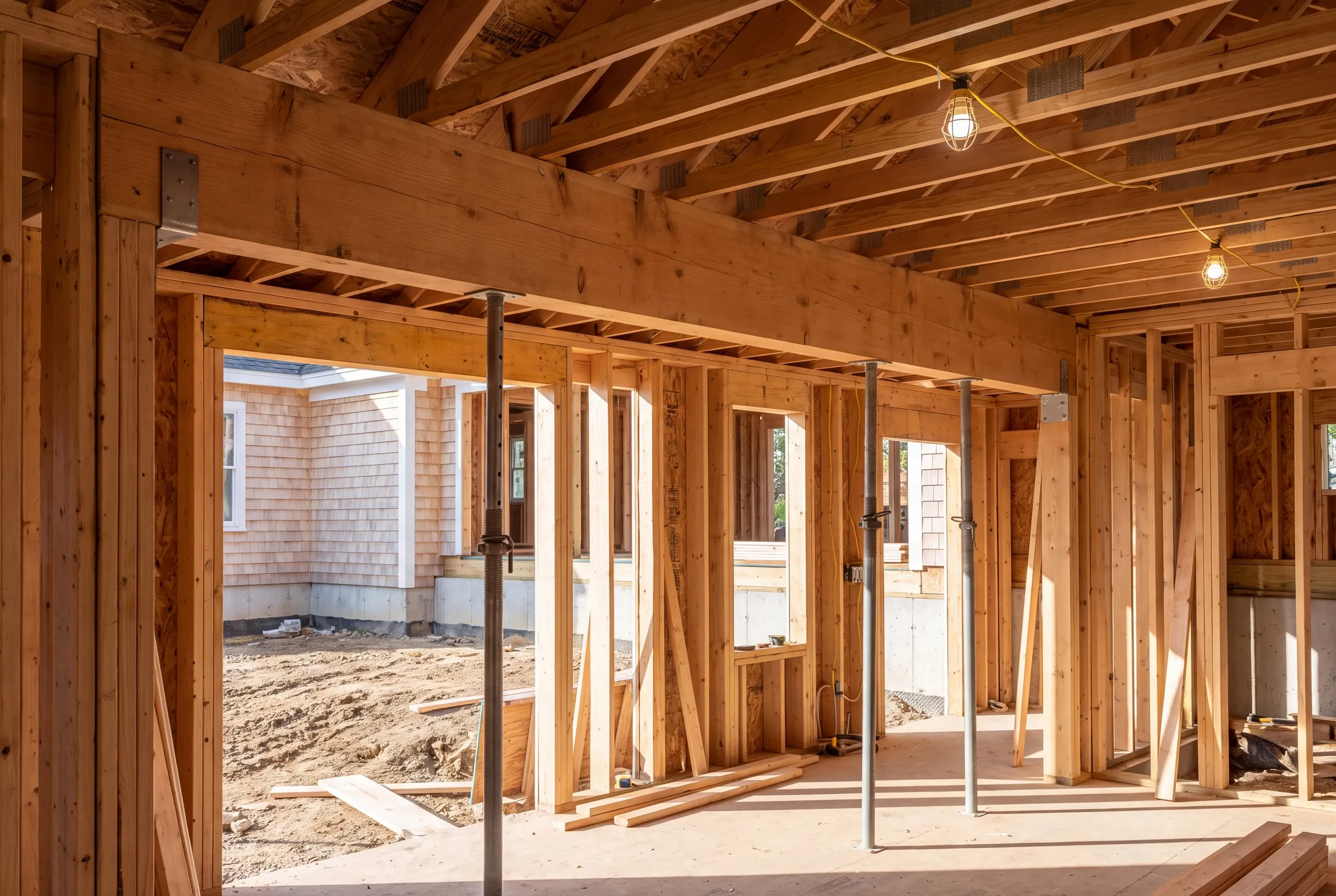 Structural beam being set during a Maine house renovation