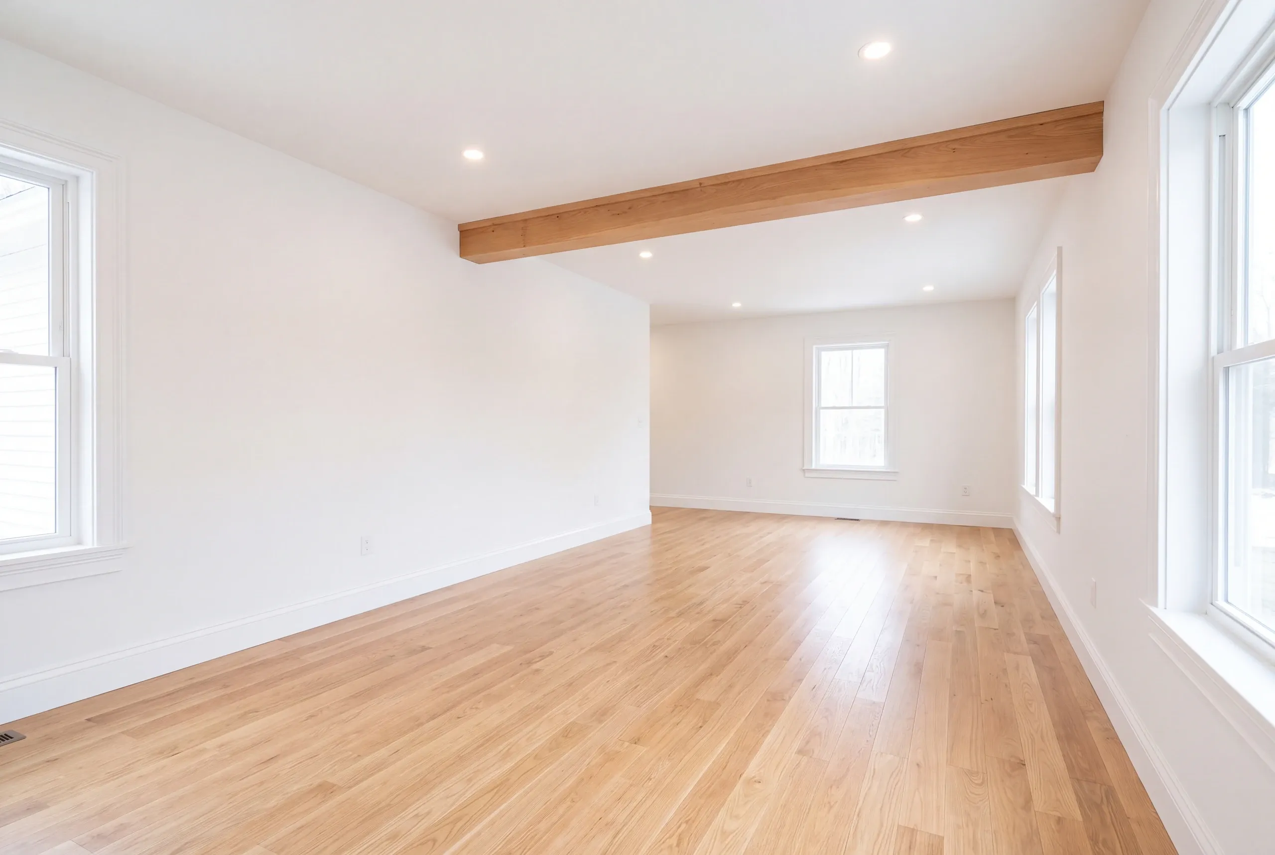 Finished renovated living space in a Sidney, Maine home, wide interior view