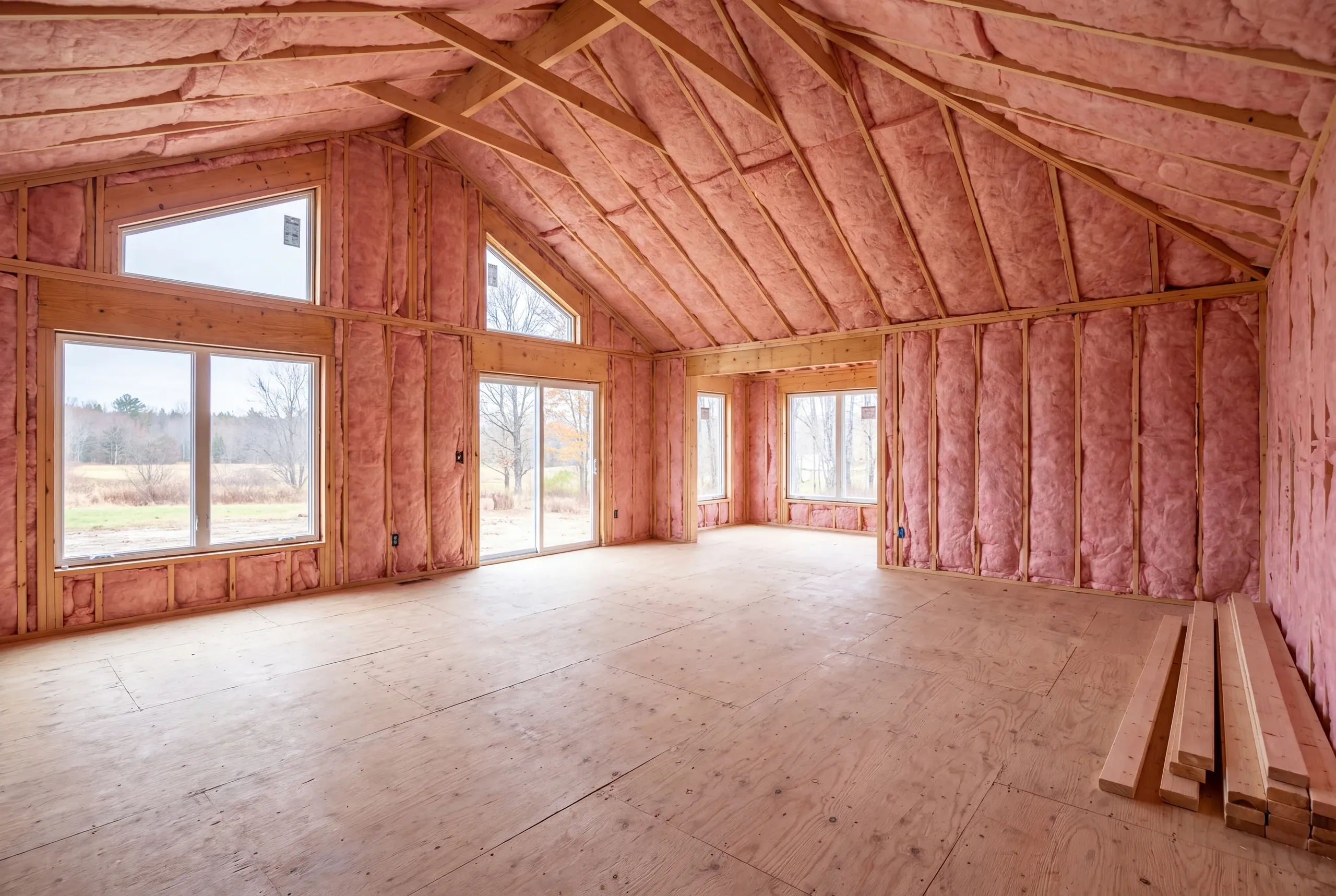 Crew installing insulation after mechanical rough-in in a Vassalboro house