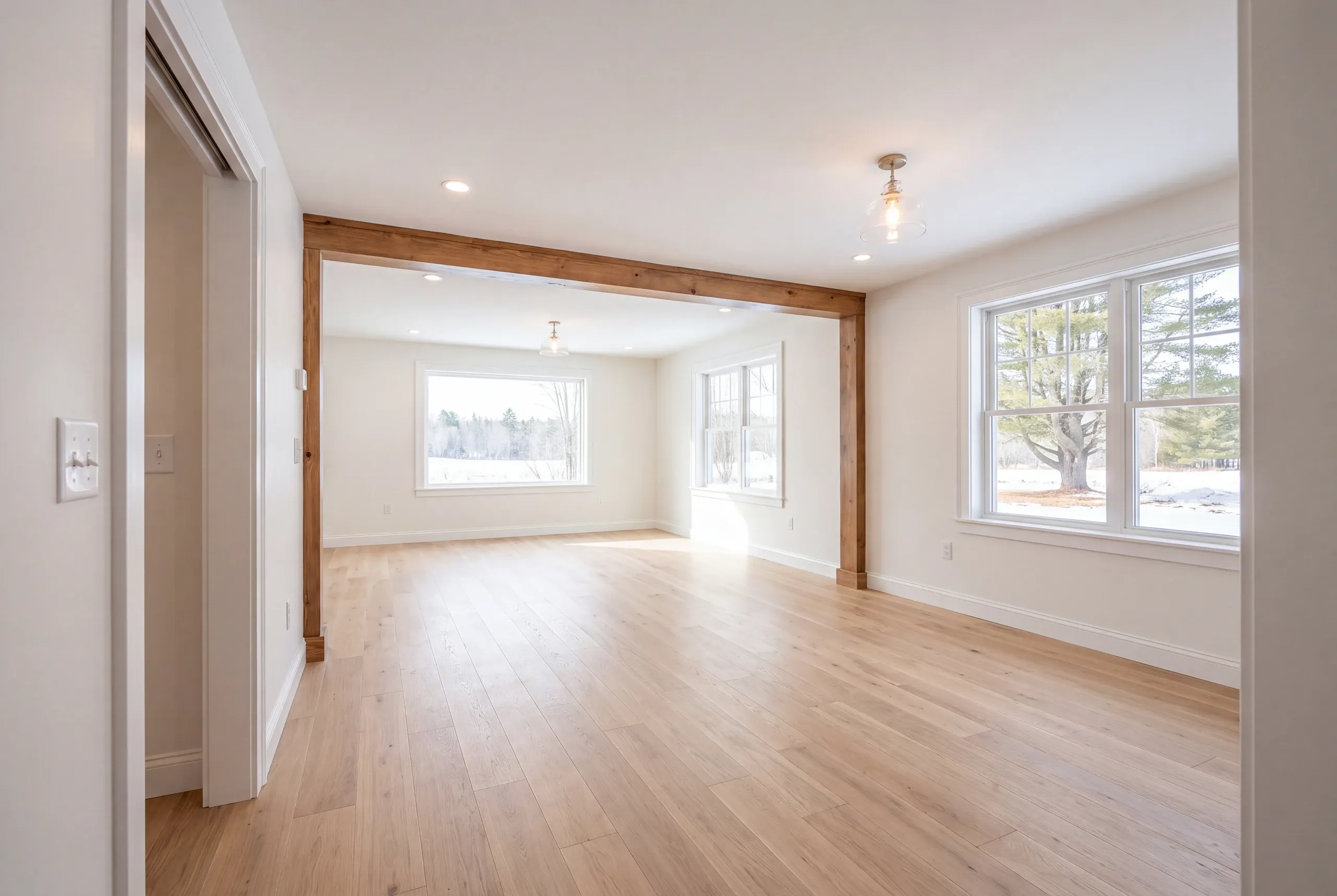 Finished renovated living room in a Vassalboro home seen from the hall