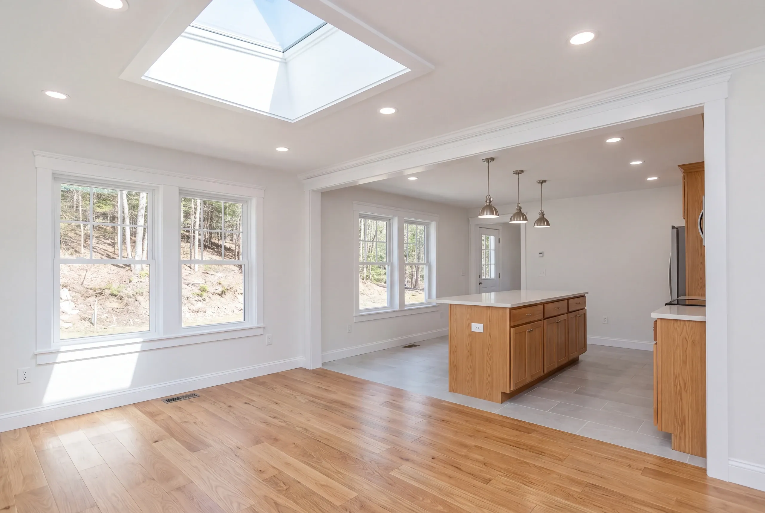 Builder reviewing heating costs with a homeowner in Vienna, Maine