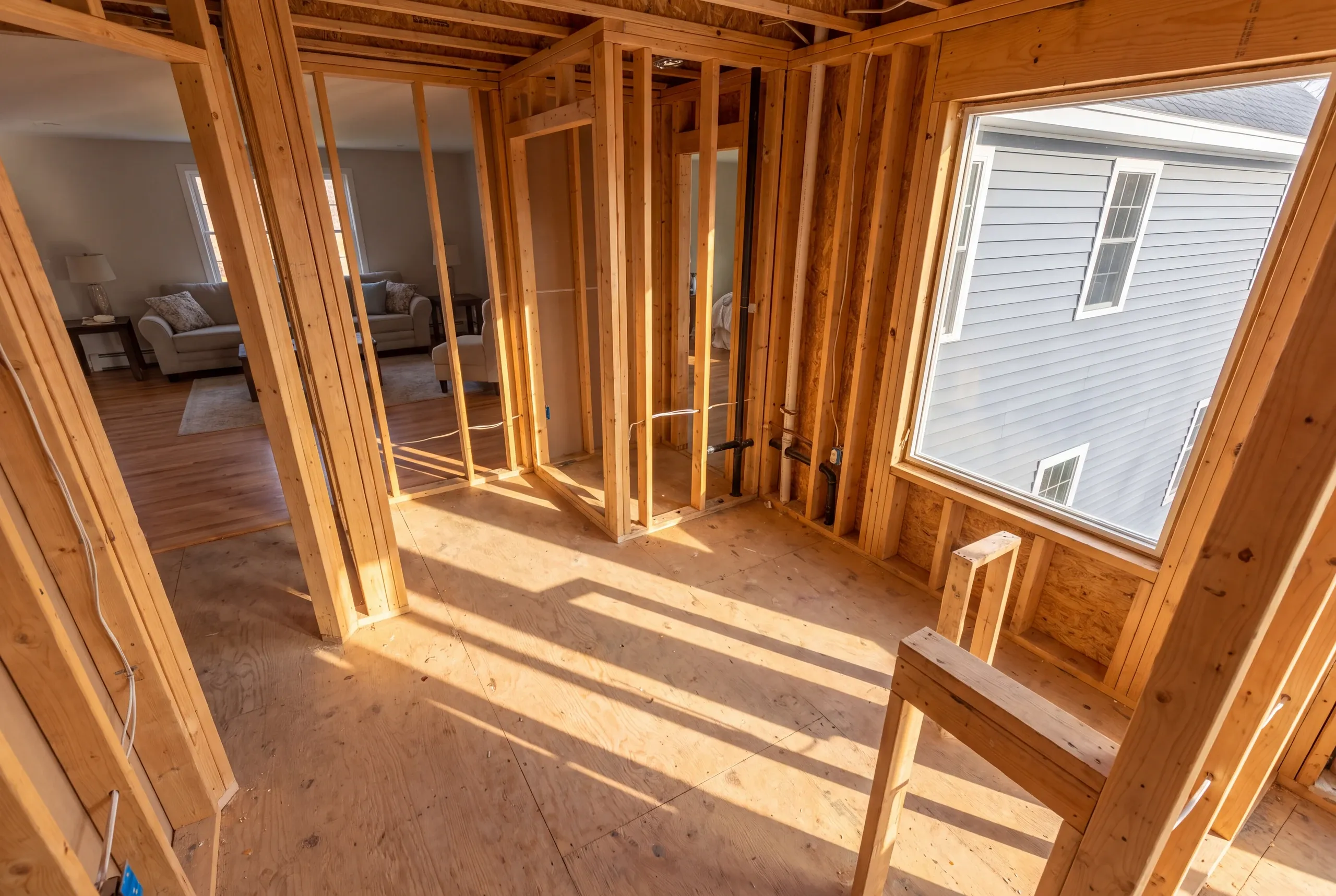 Crew framing a new bathroom in a Winslow split-level