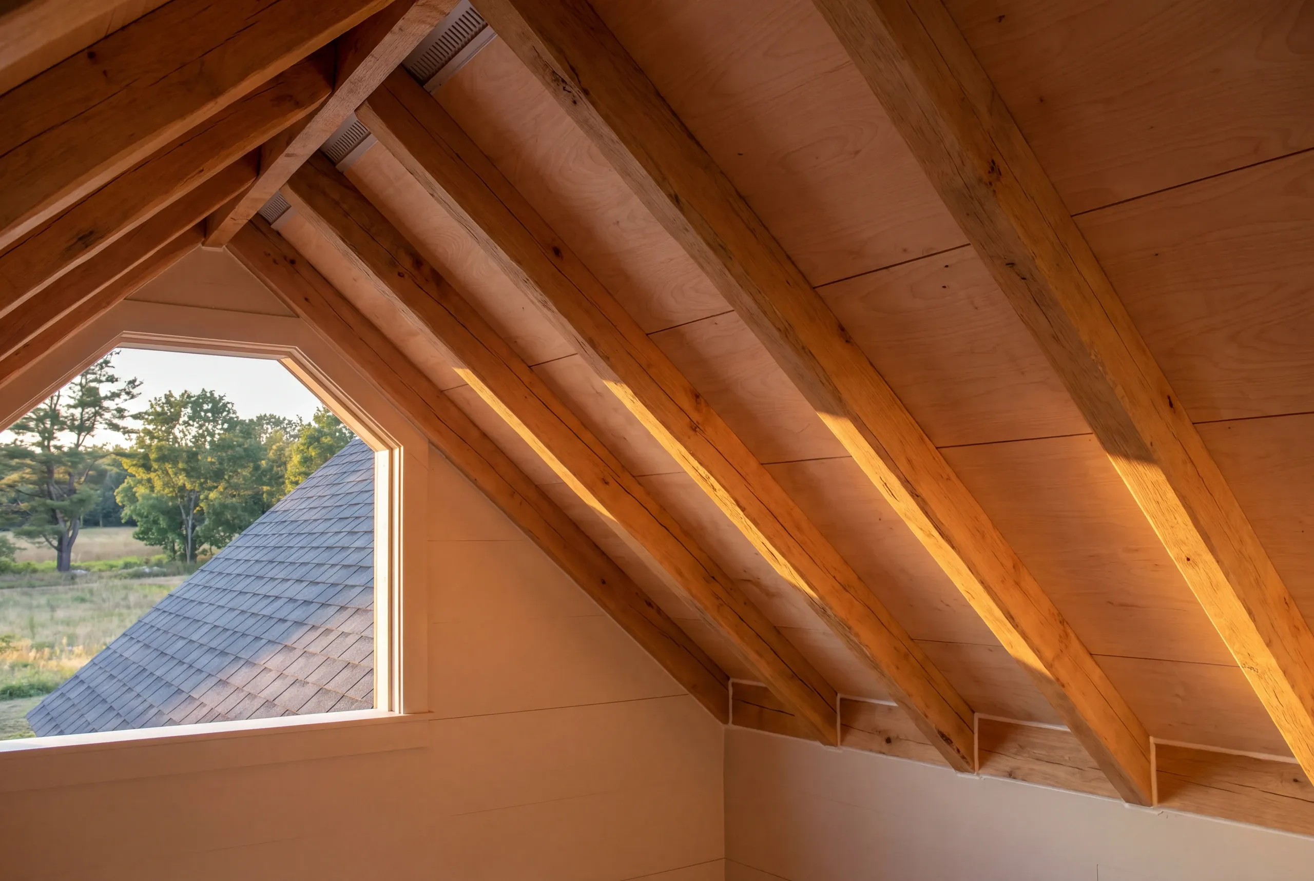 Hand-hewn rafters visible in an Alna farmhouse attic