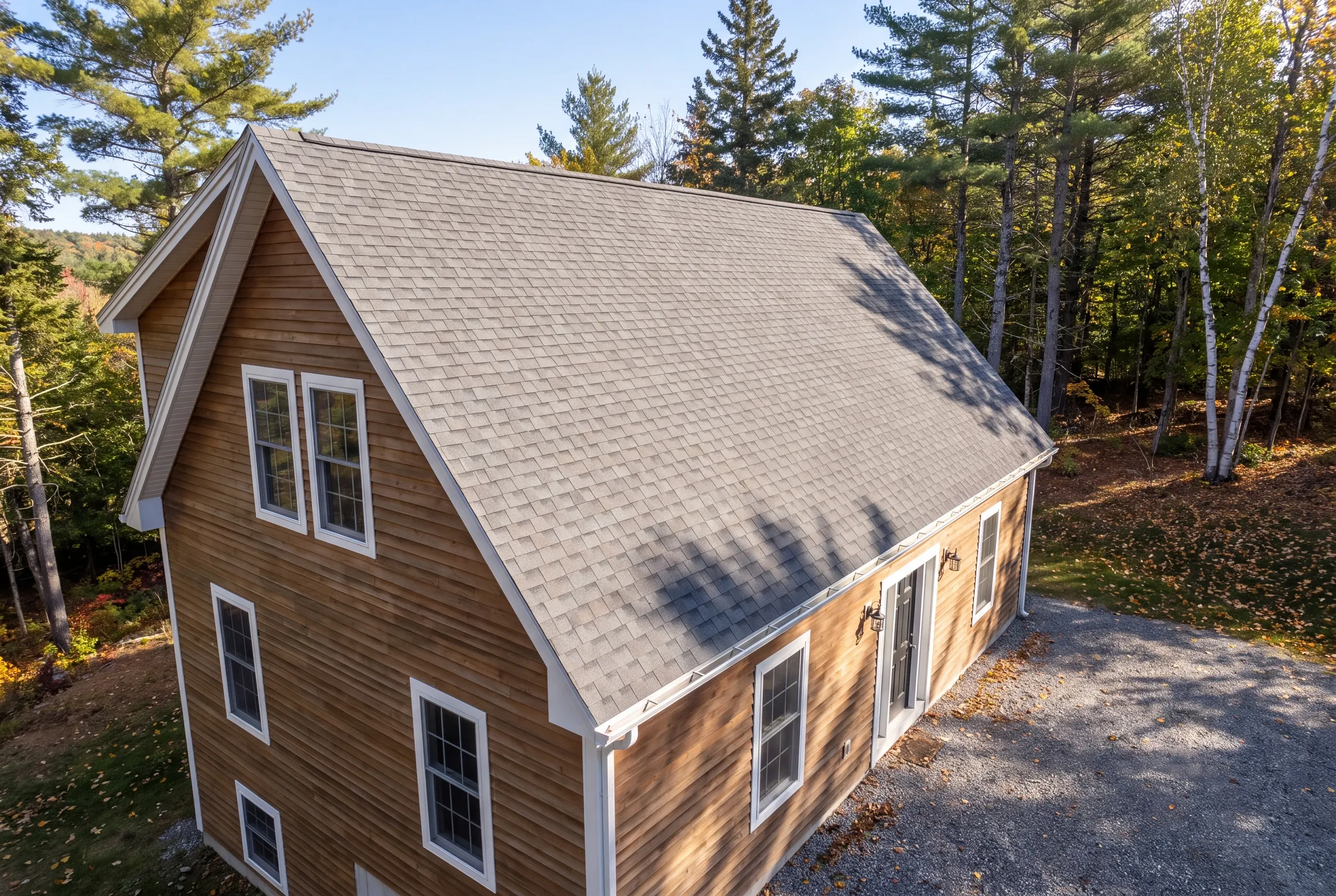 Finished roof, eaves and new gutter line on a Vienna home seen from the driveway