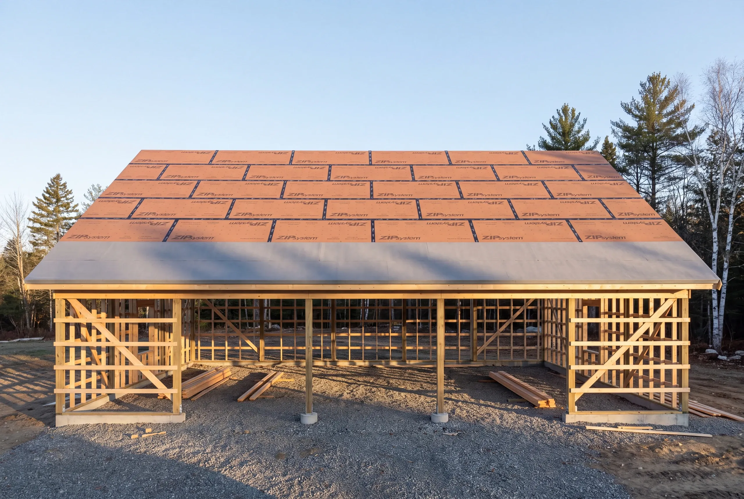 Pole barn roof panel going on in Whitefield