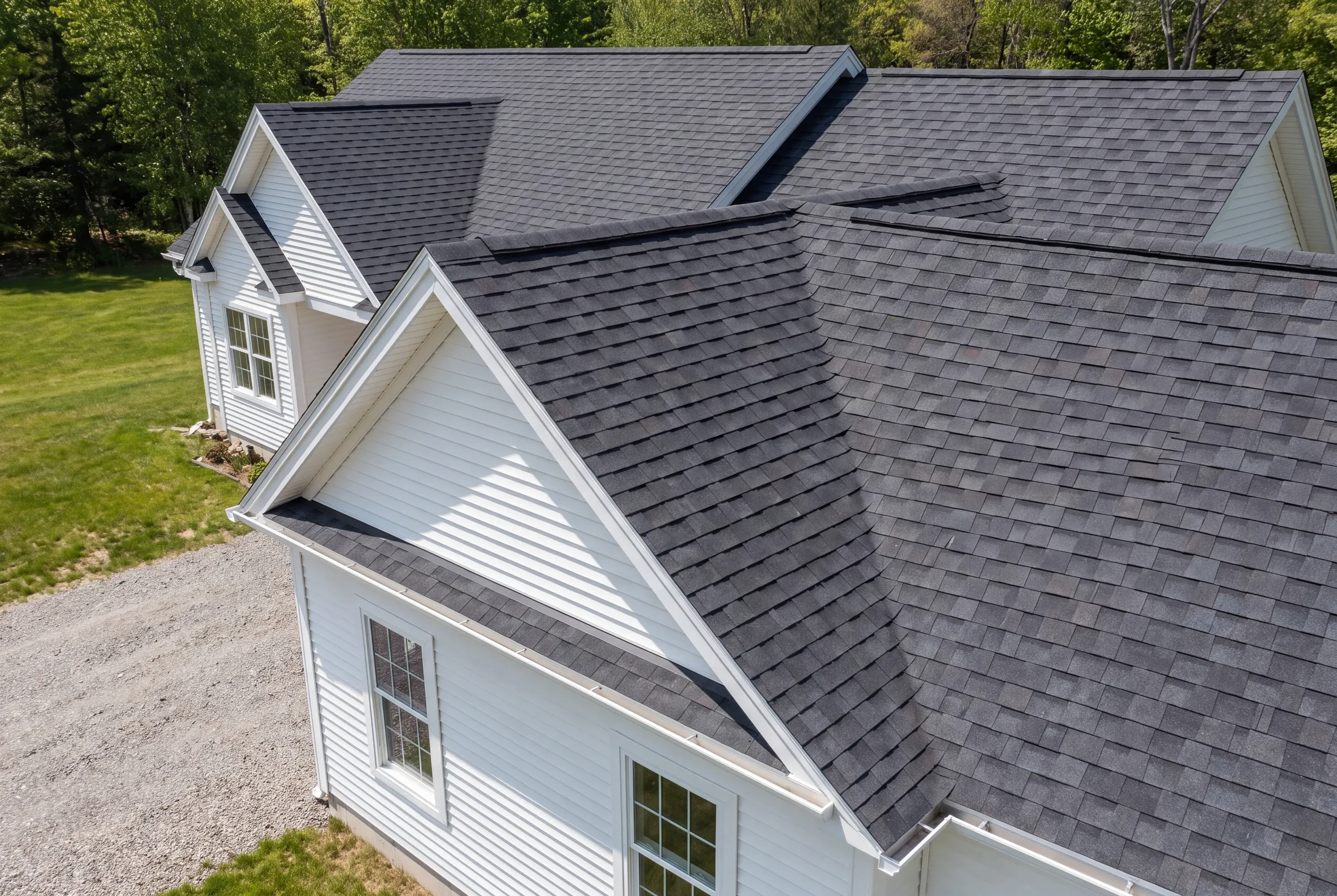 Finished roof, eaves and new gutter line on a Windsor home seen from the driveway