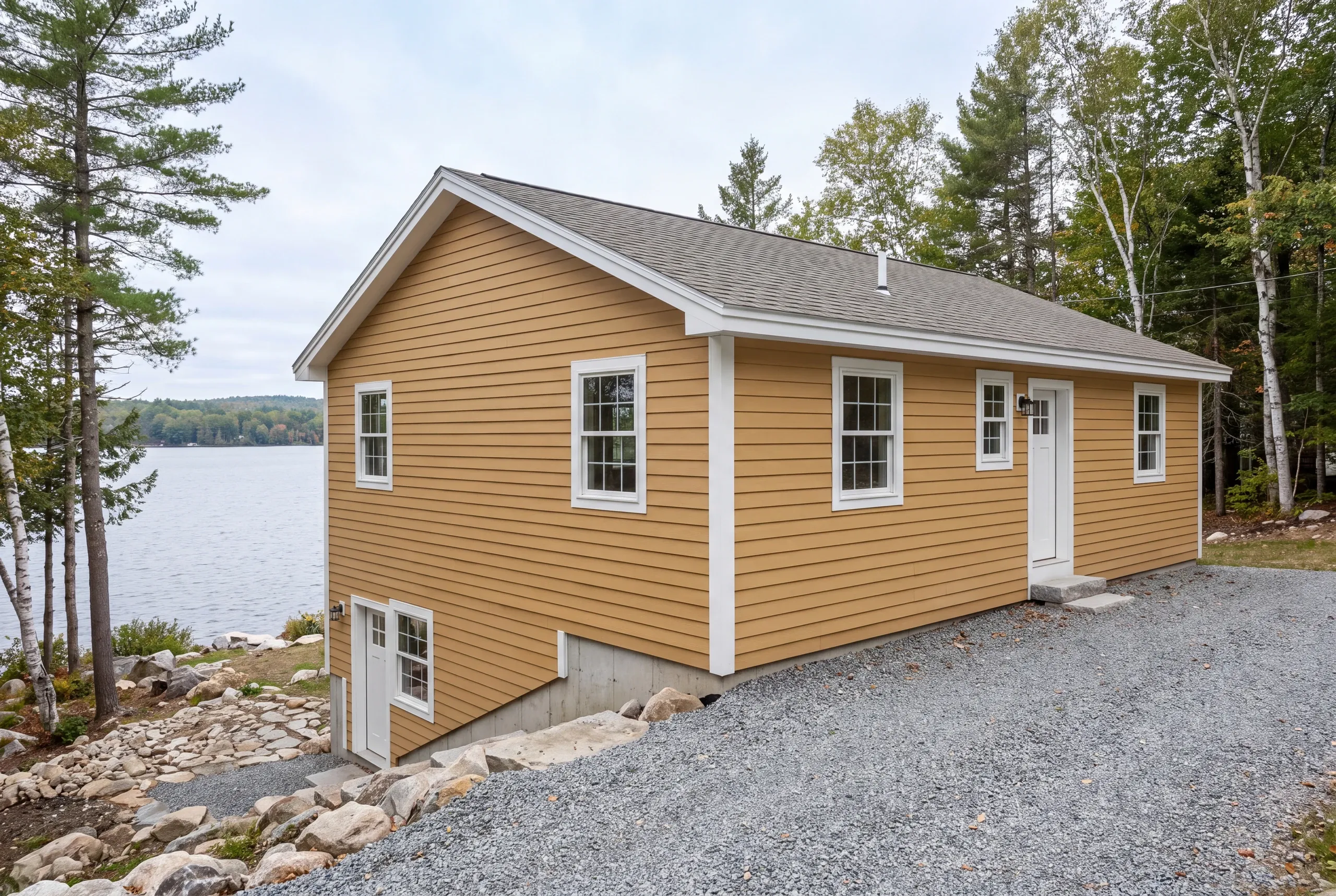 House wrap going on an Oakland lake property for the first time
